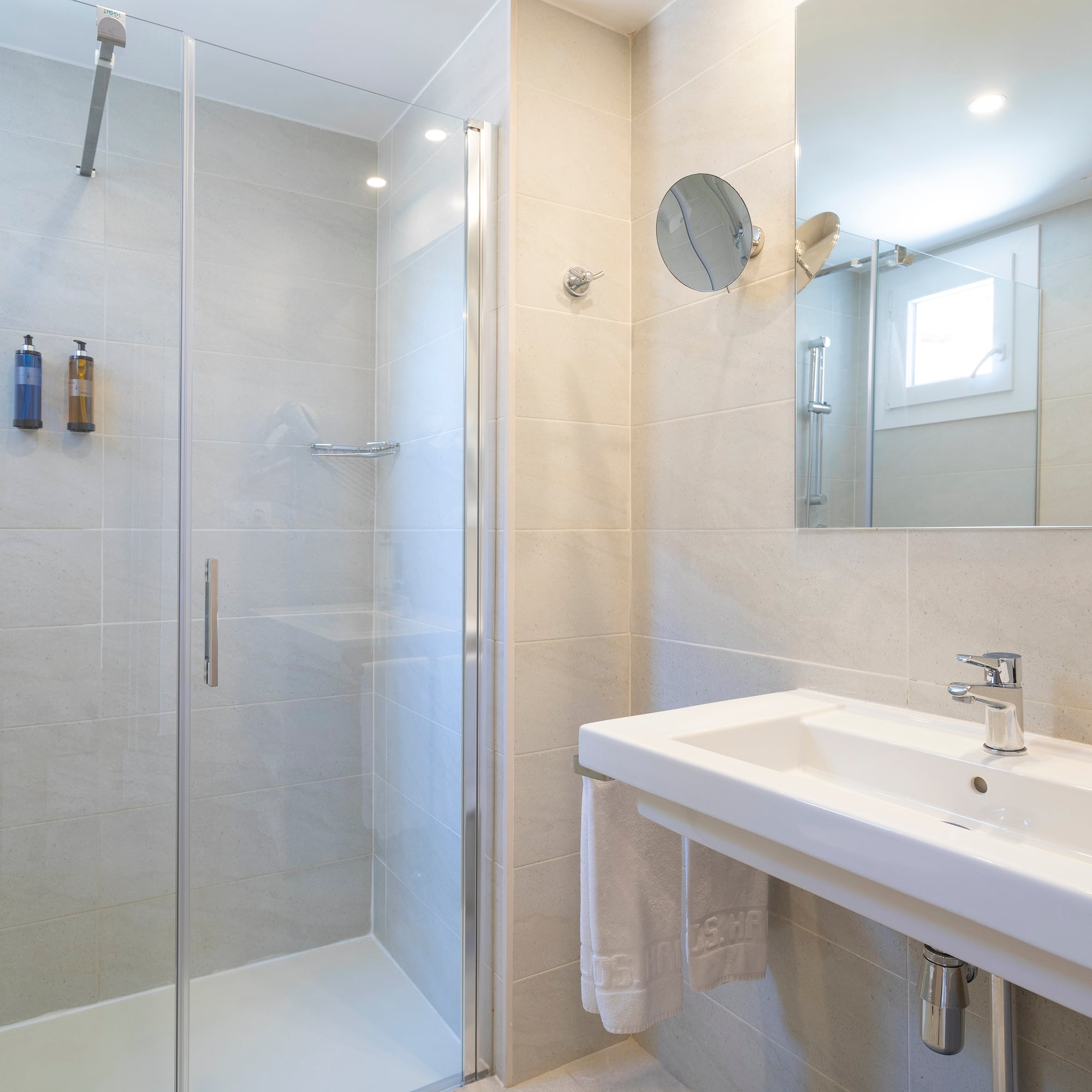 a bathroom with a shower and sink