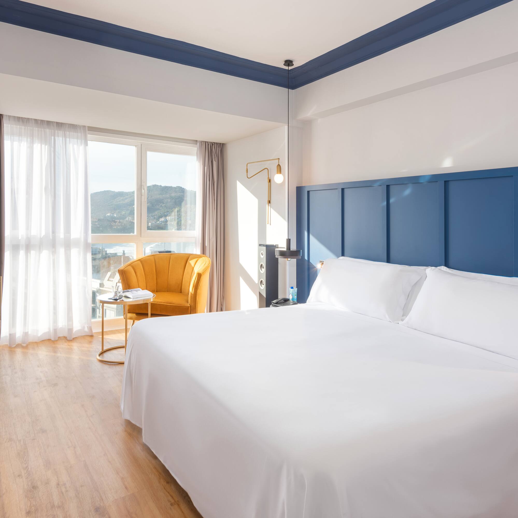 a room with a bed and a chair