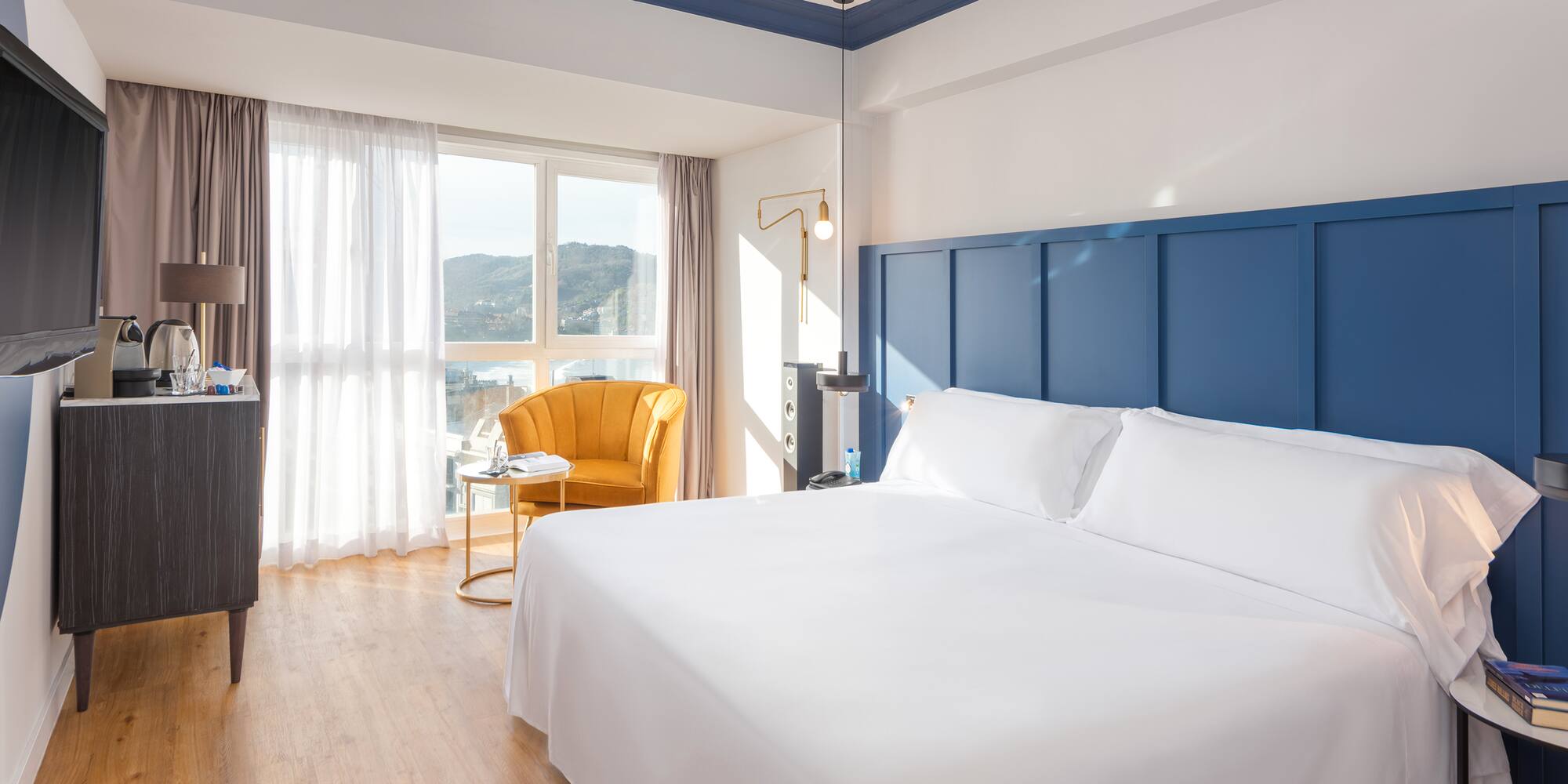 a room with a bed and a chair