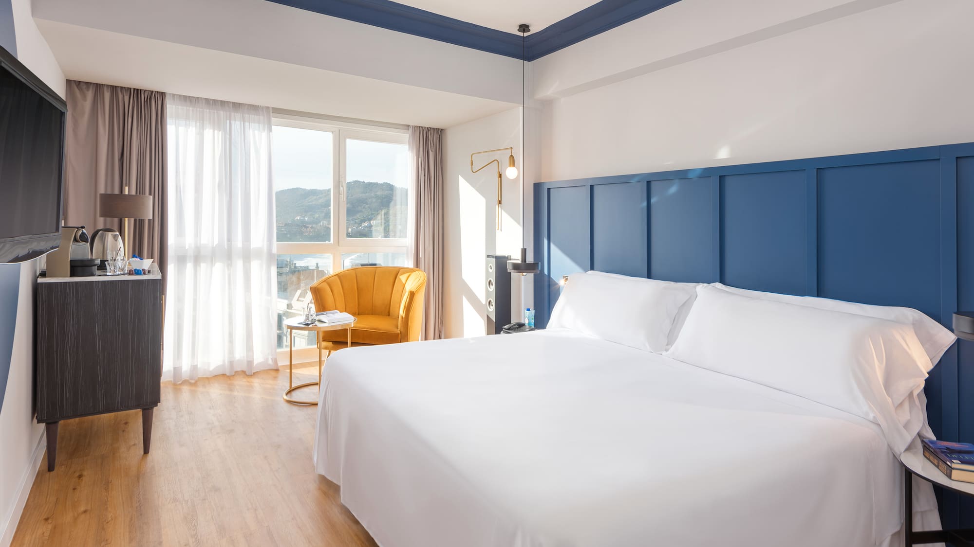 a room with a bed and a chair