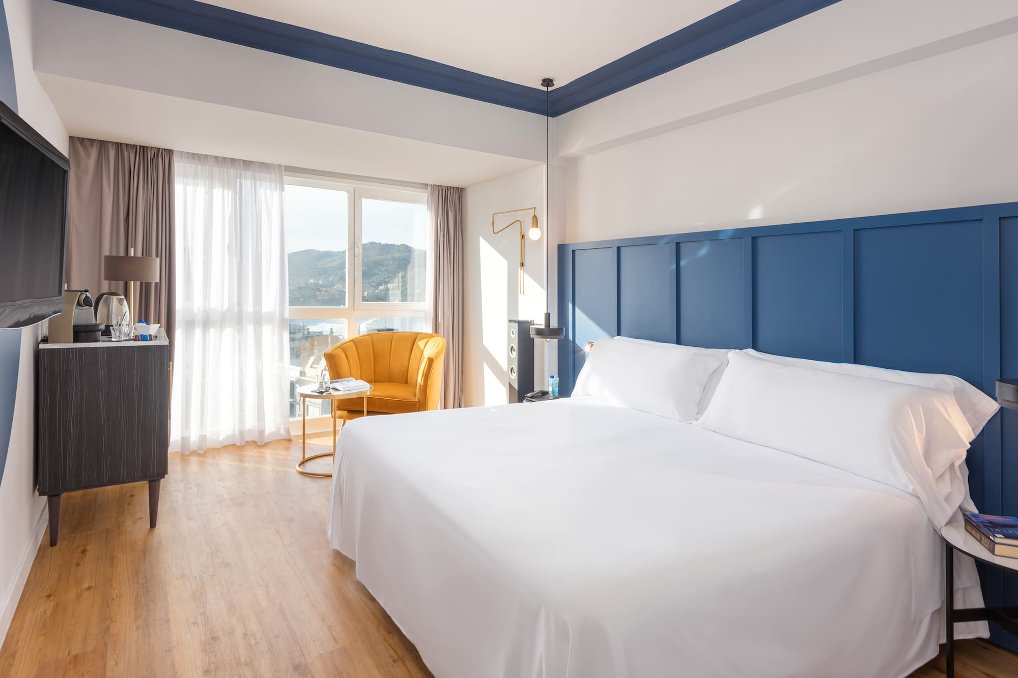 a room with a bed and a chair