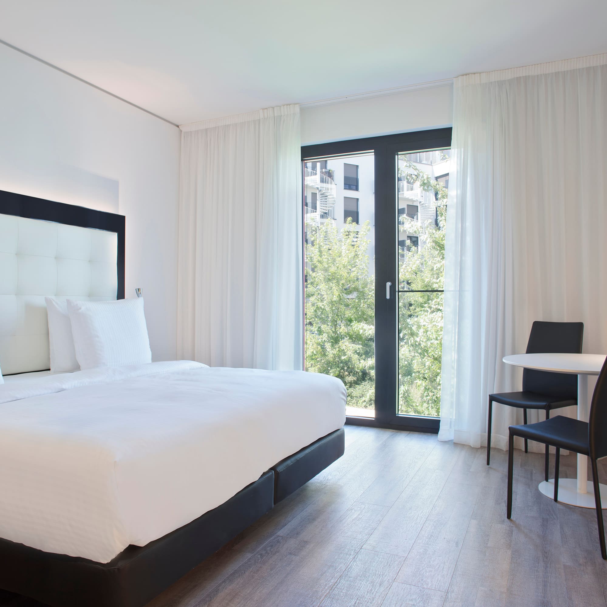 a bedroom with a bed and a table