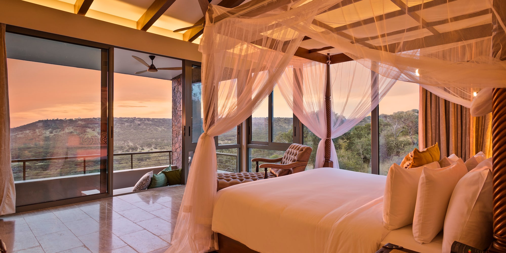 a bedroom with a canopy over a bed