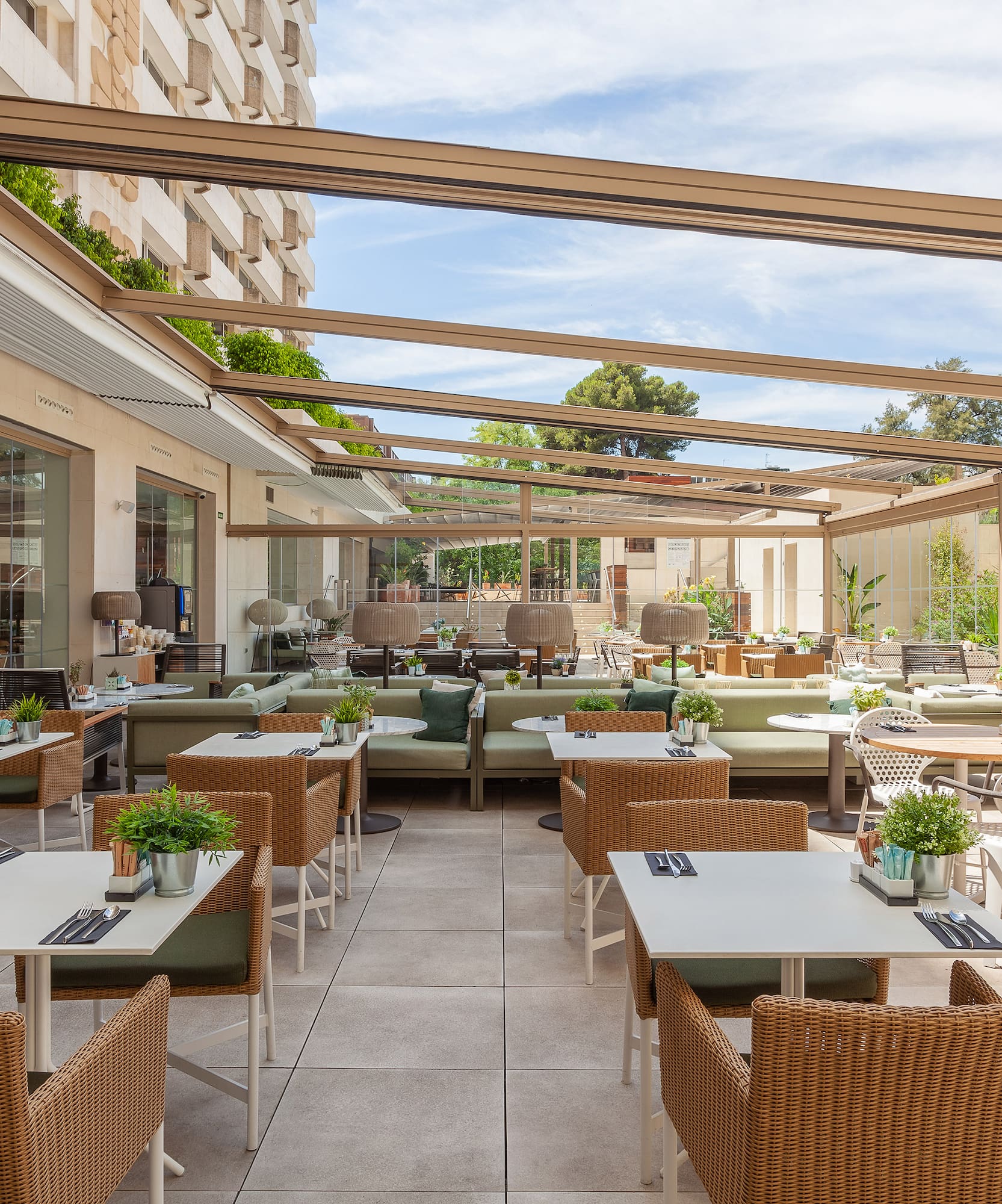a patio with tables and chairs