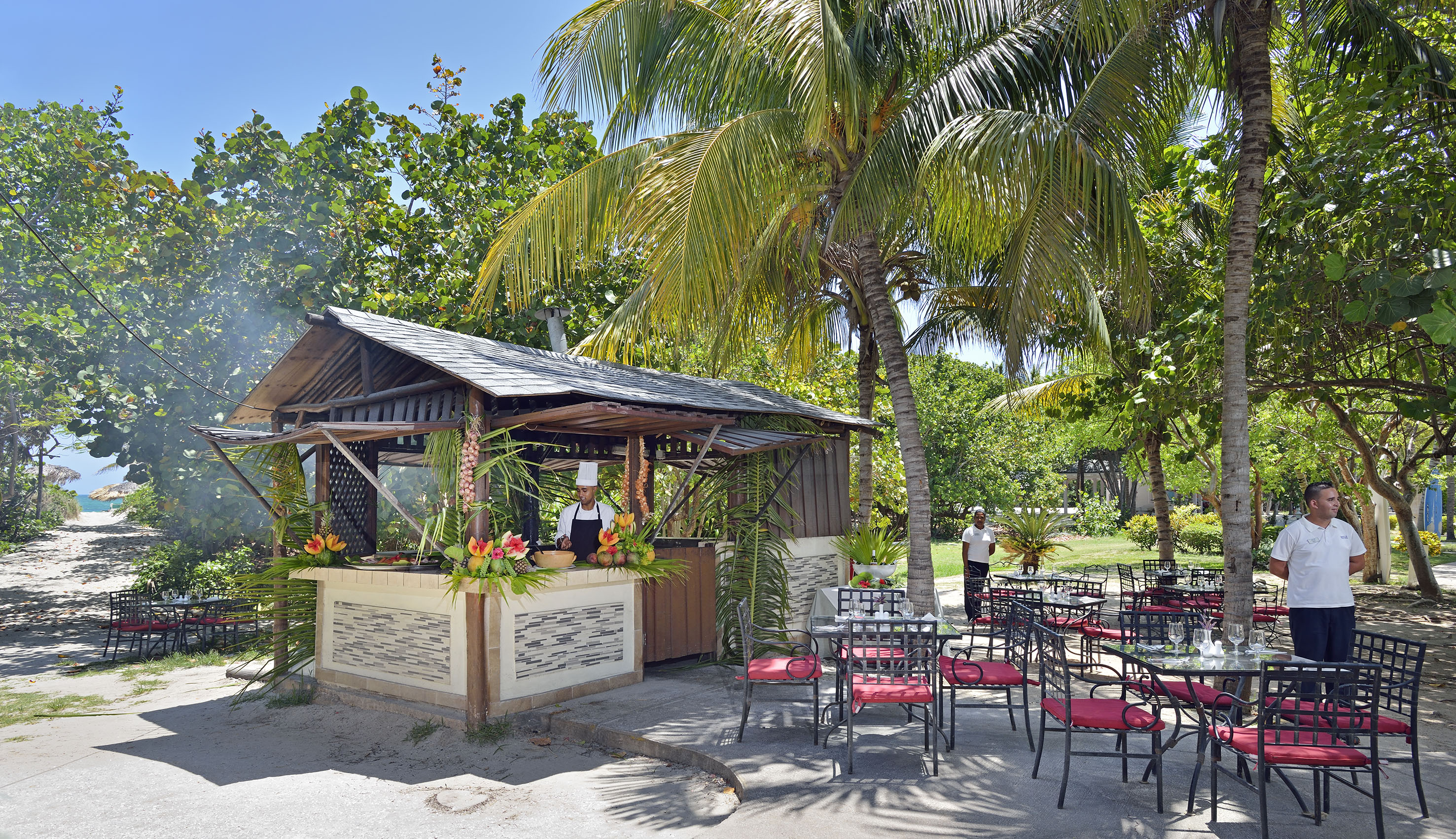 a man standing behind a bar