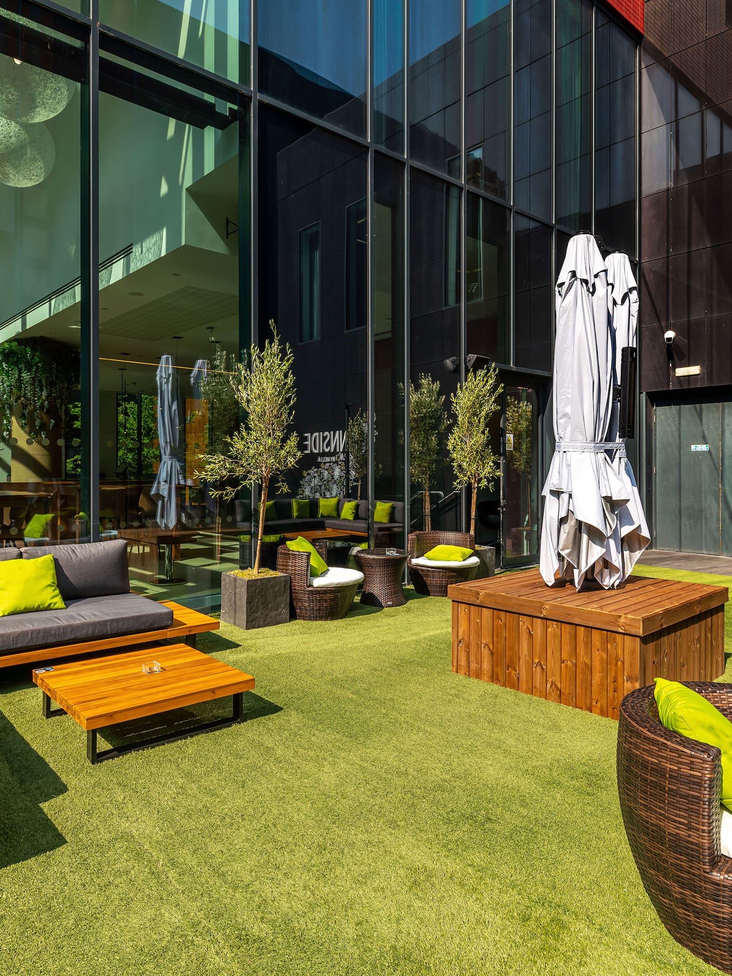 a patio area with chairs and tables