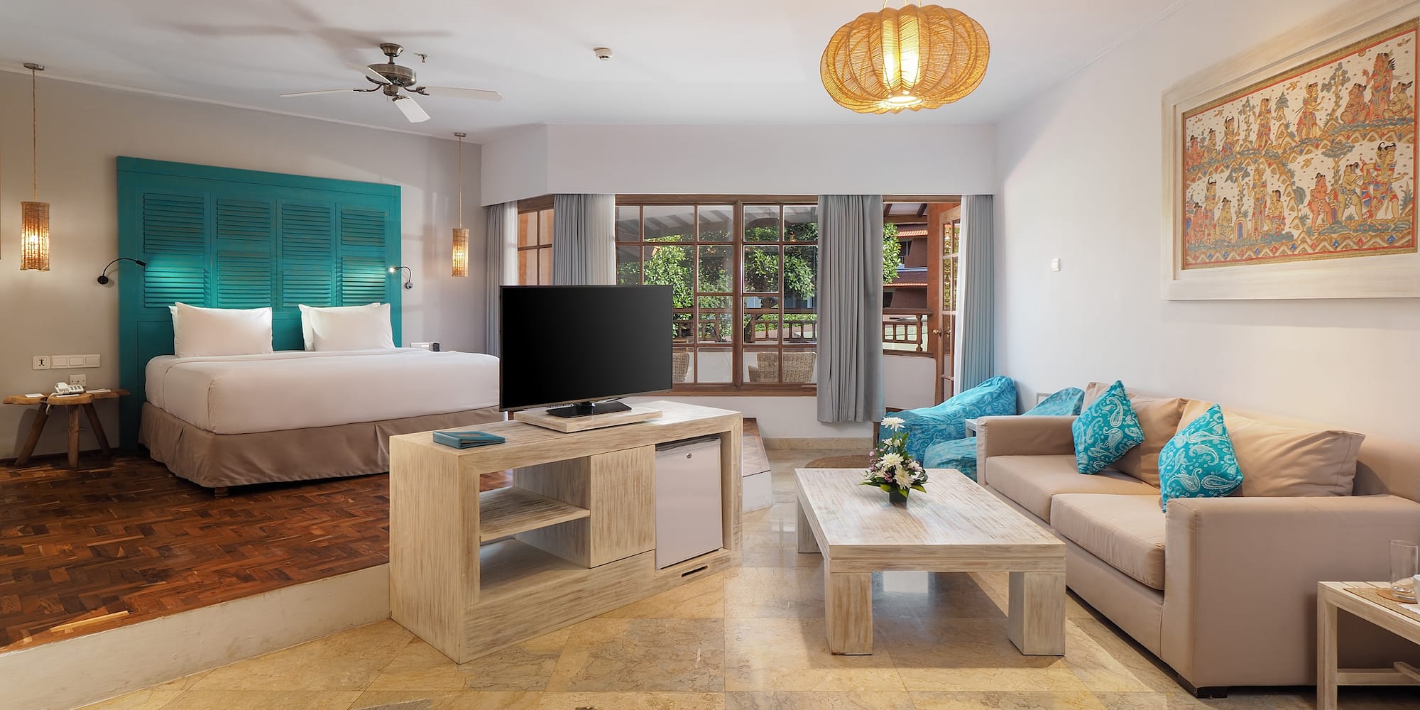 a room with a television and a bed