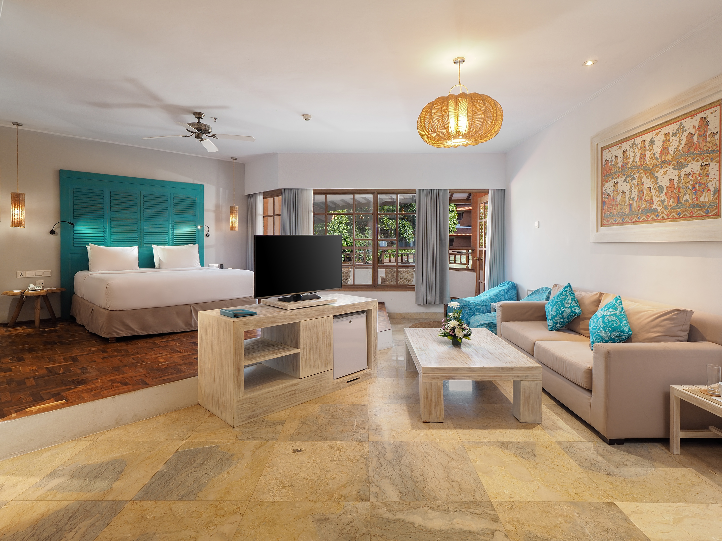 a room with a television and a bed