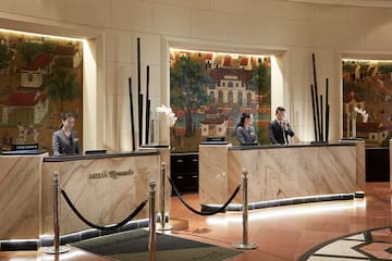 a group of people standing at a reception desk
