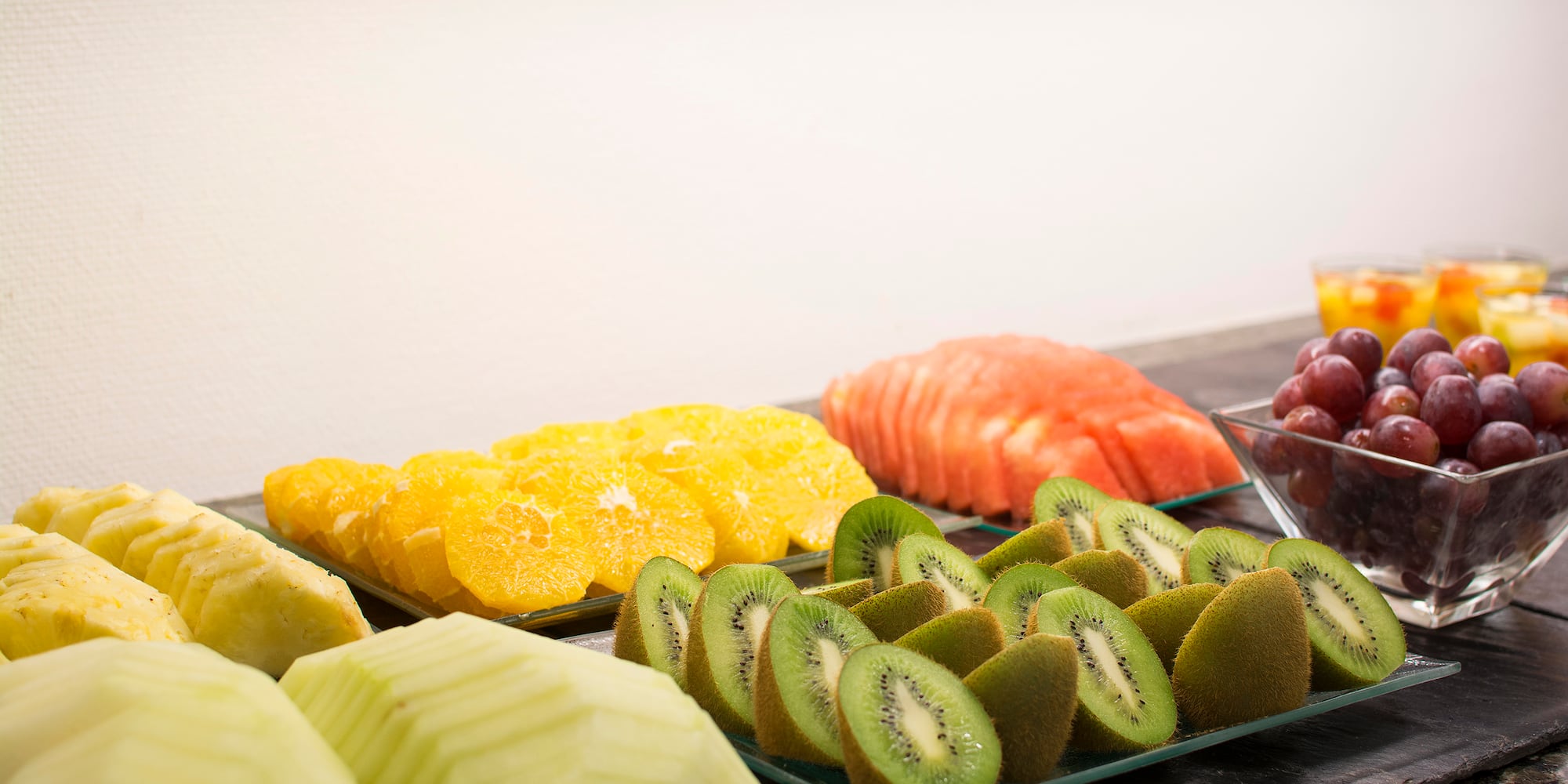 a group of different fruits on plates
