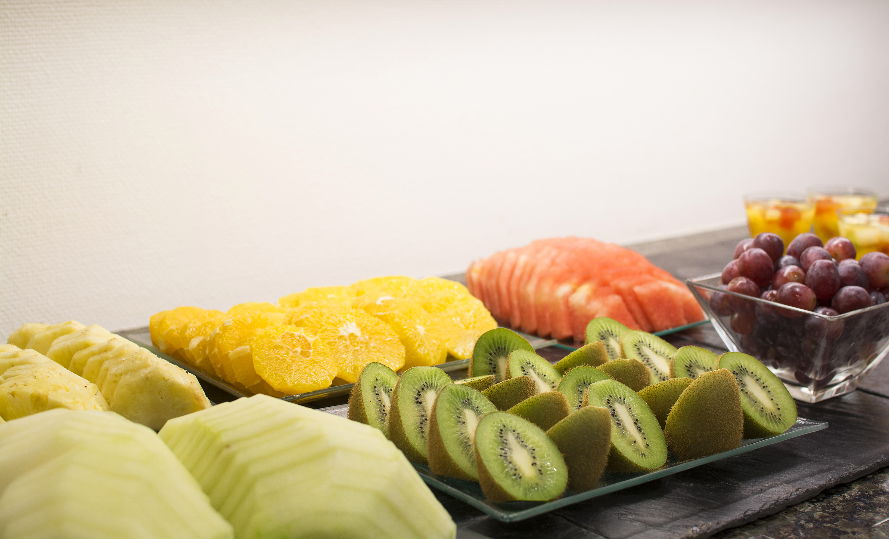 a group of different fruits on plates