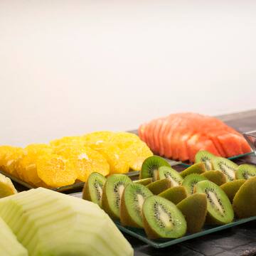 a group of different fruits on plates
