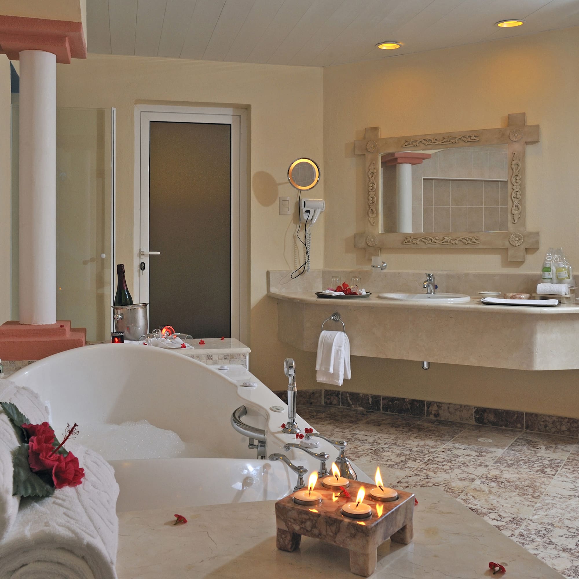 a bathroom with a bathtub and candles