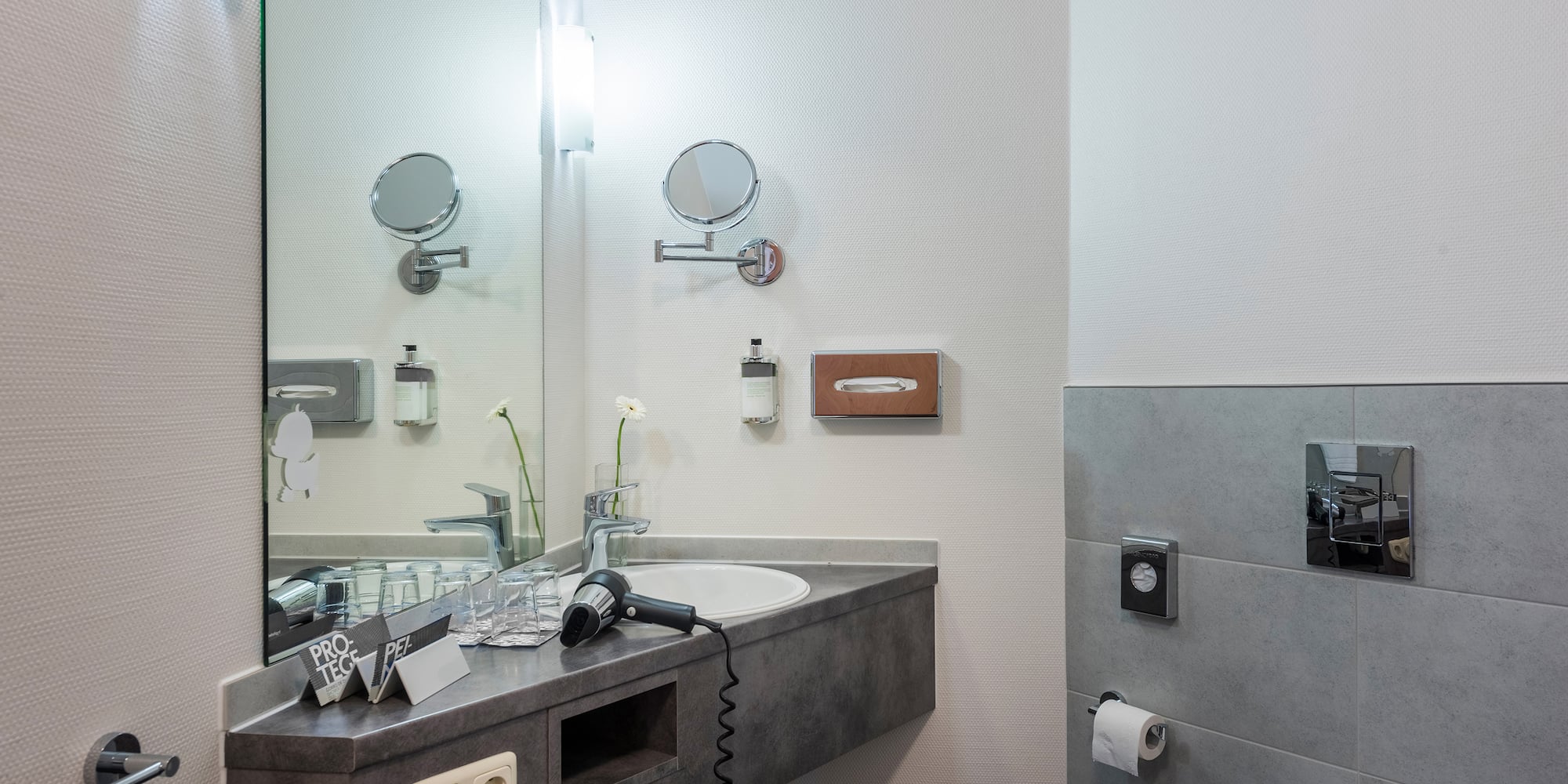 a bathroom with a sink and mirror