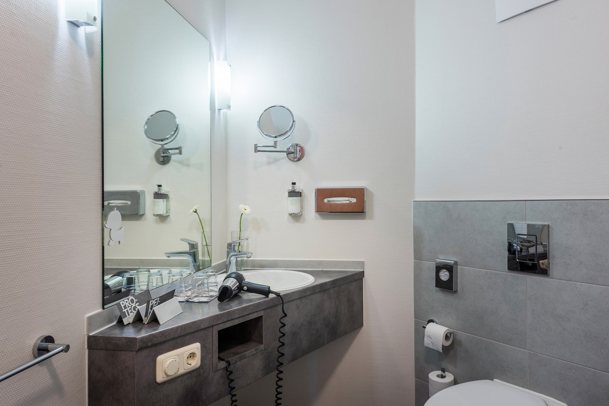 a bathroom with a sink and mirror