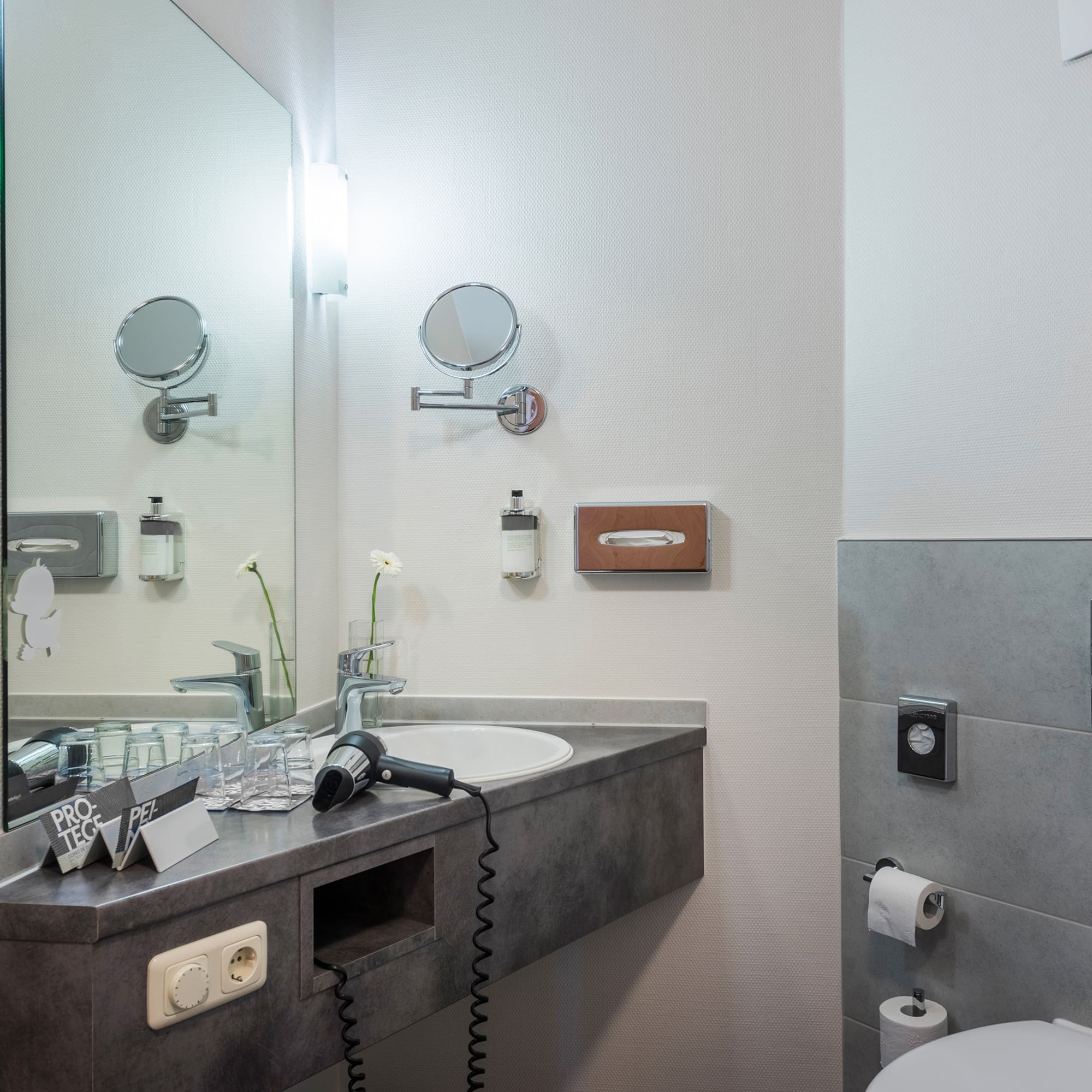 a bathroom with a sink and mirror