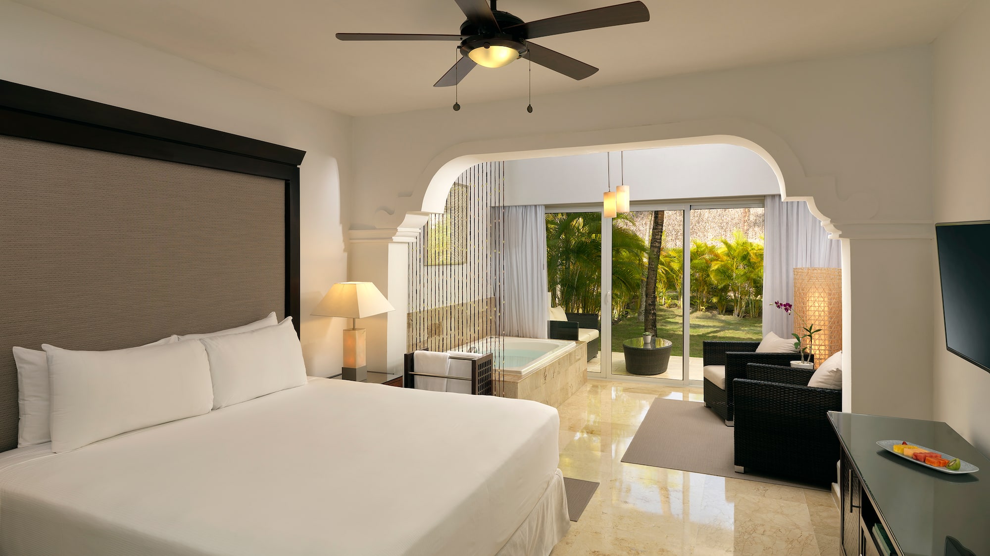 a room with a bed and a tub