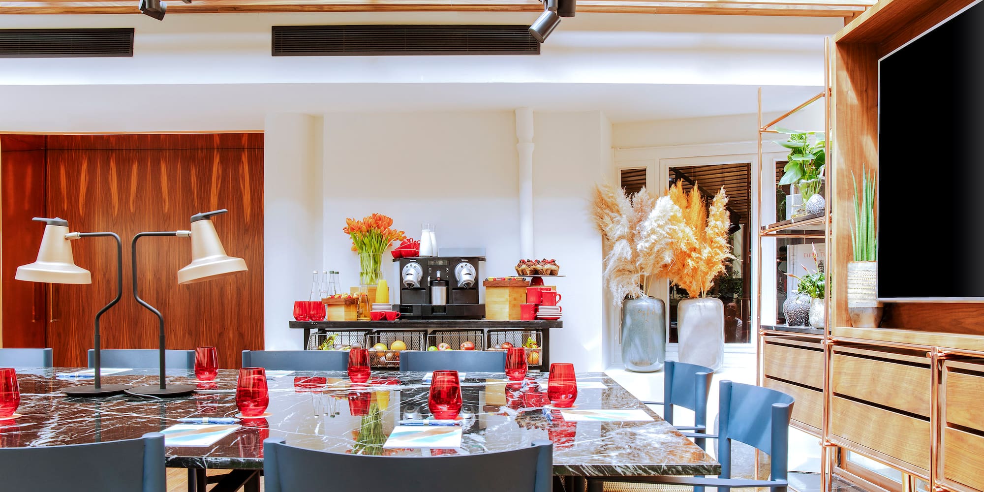 a dining room with a table and chairs