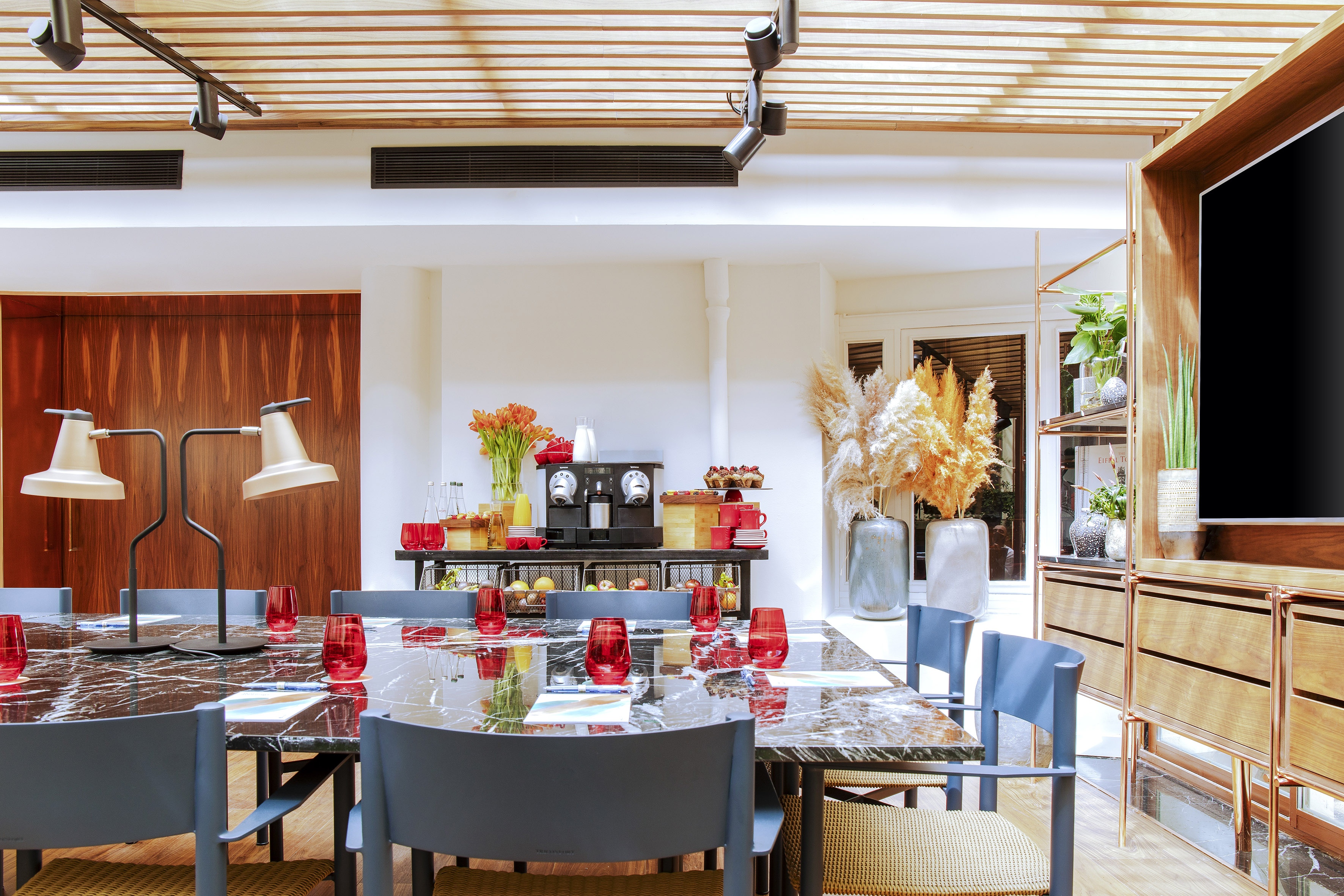 a dining room with a table and chairs