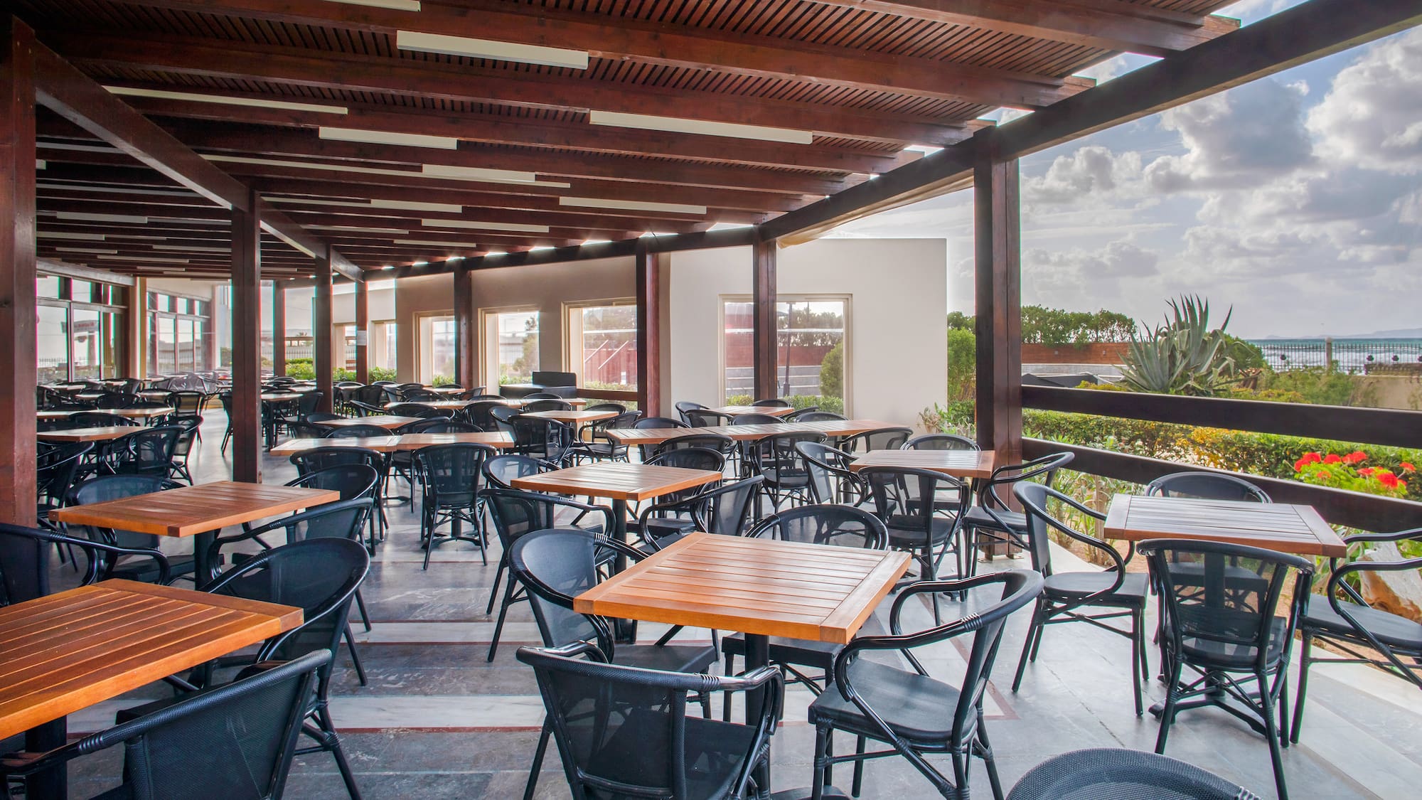 a patio with tables and chairs