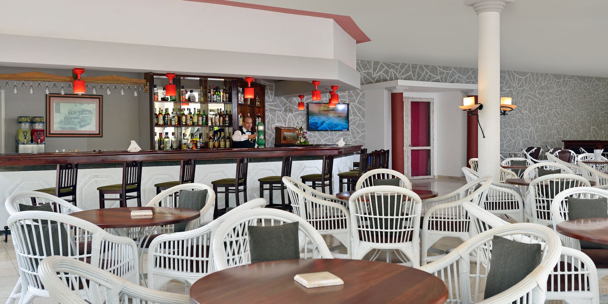 a bar with tables and chairs