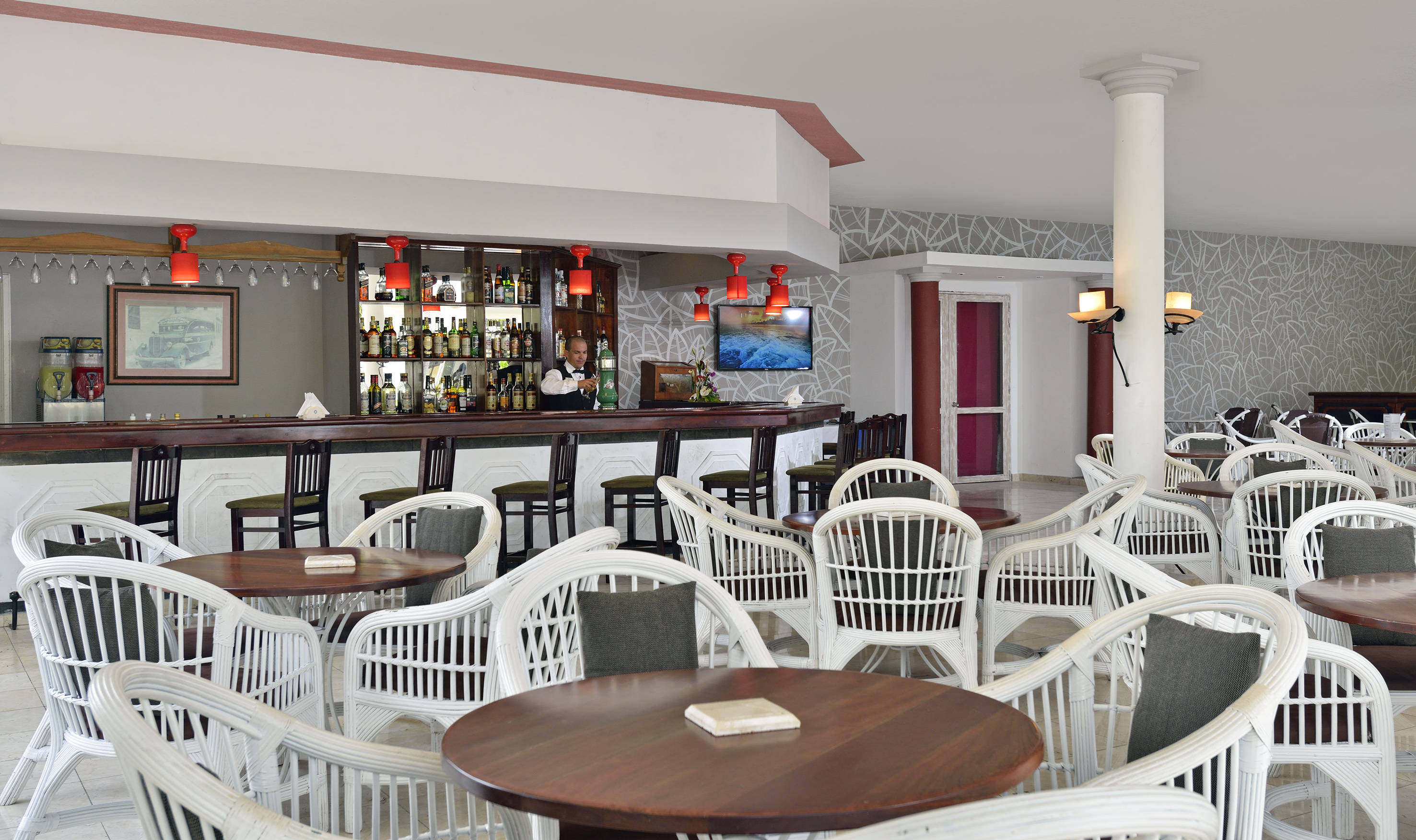 a bar with tables and chairs