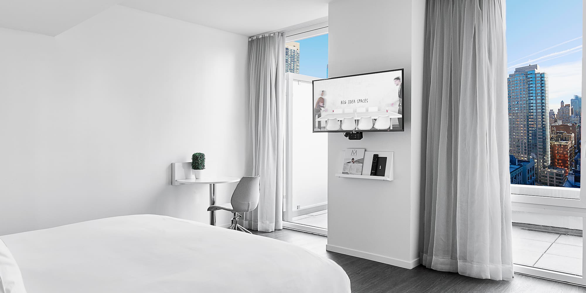 a bedroom with a bed and a desk