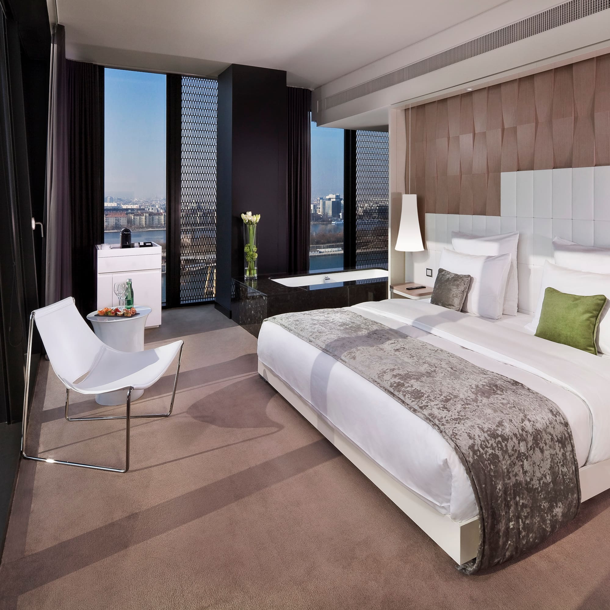 a bedroom with a bed and a chair