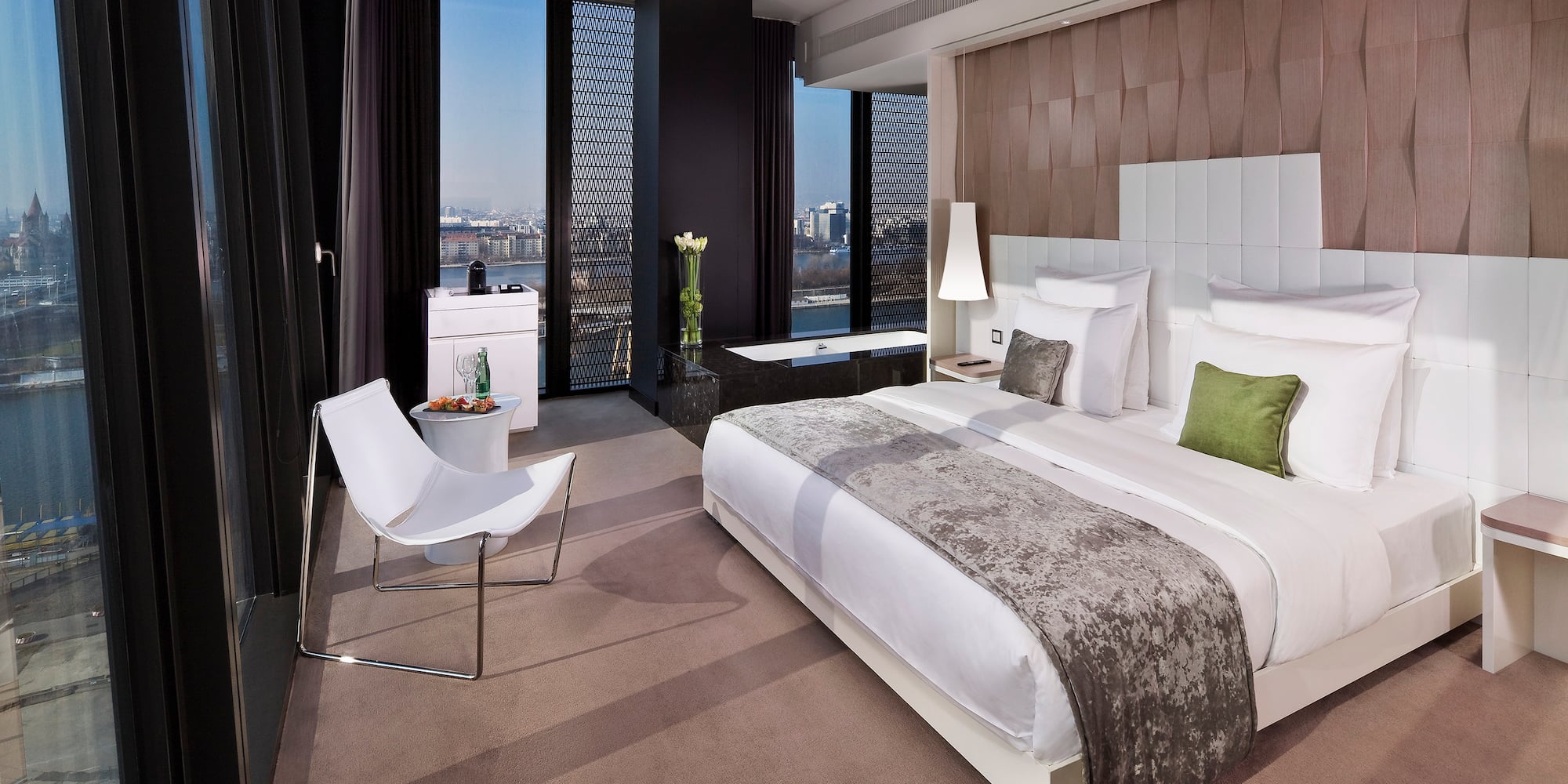 a bedroom with a bed and a chair