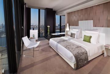 a bedroom with a bed and a chair