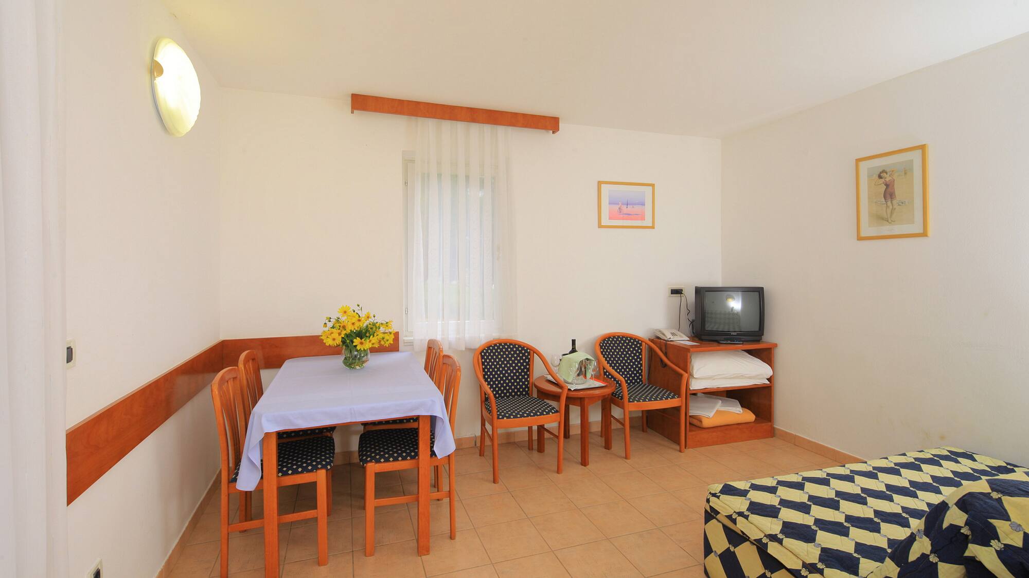 a room with a table and chairs