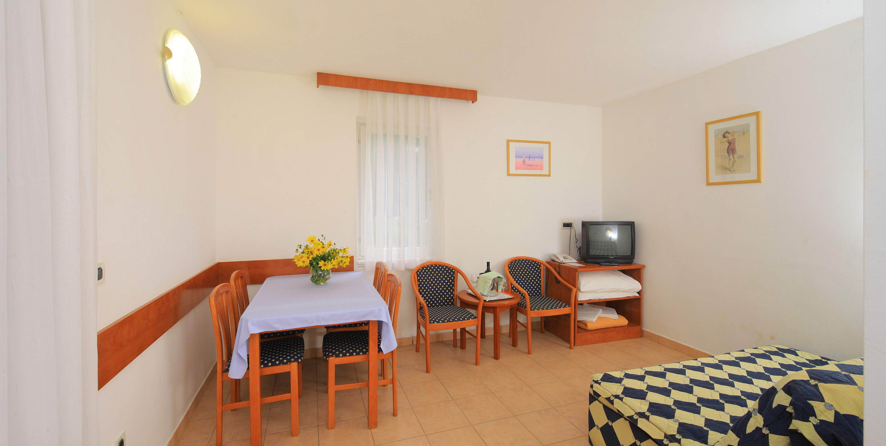 a room with a table and chairs