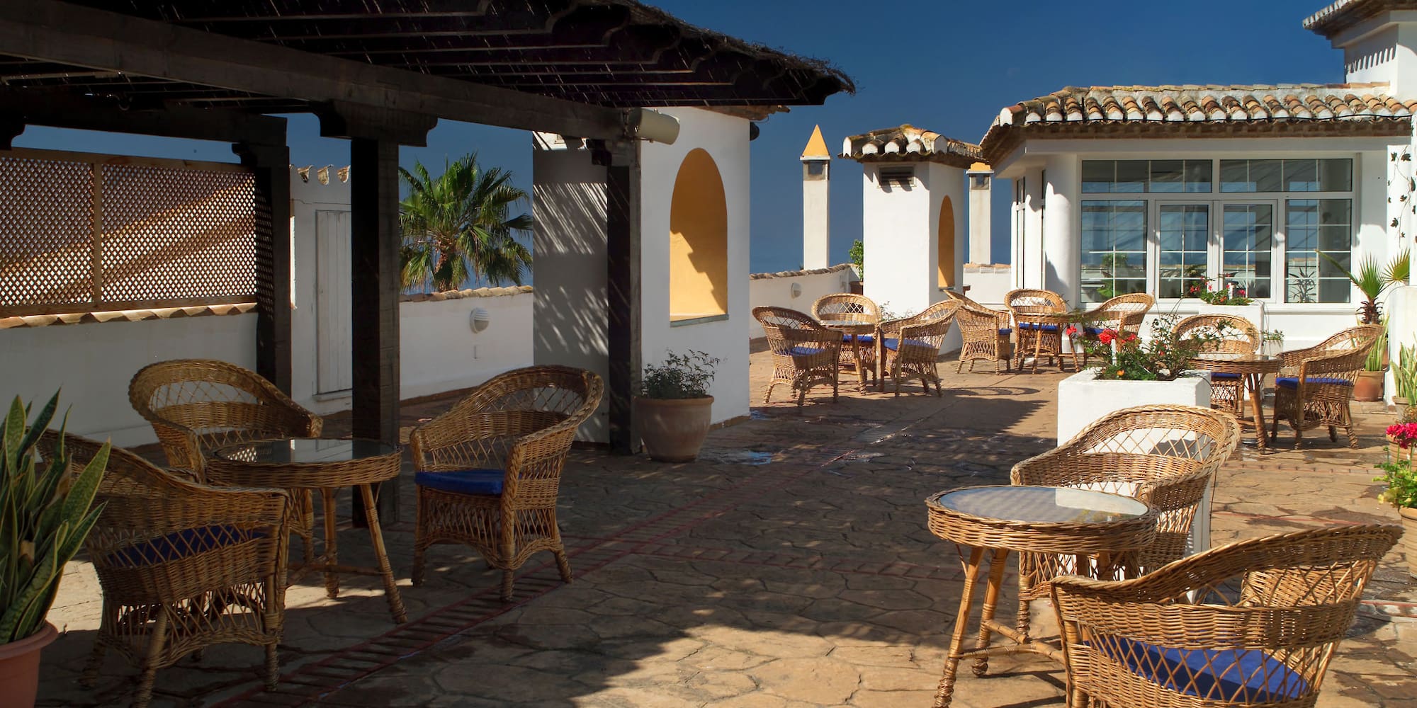 a patio with chairs and tables