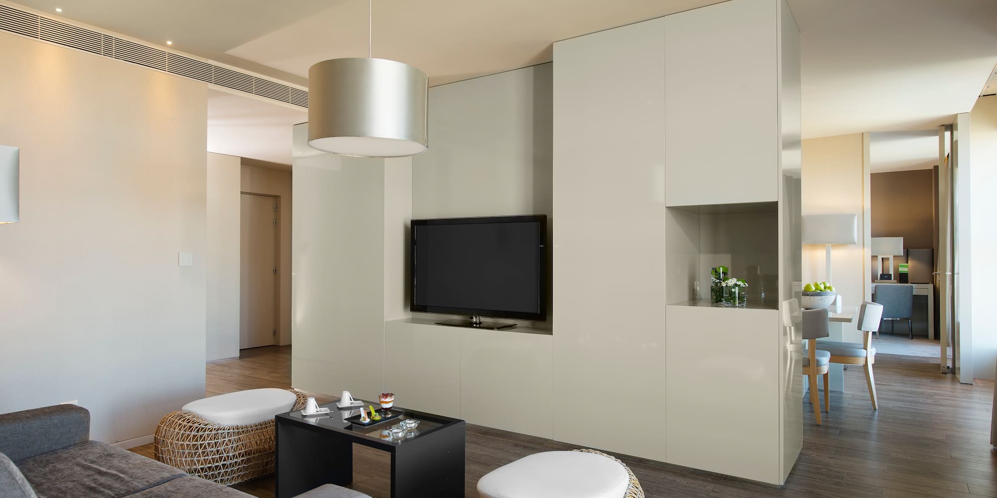 a living room with a television and a table