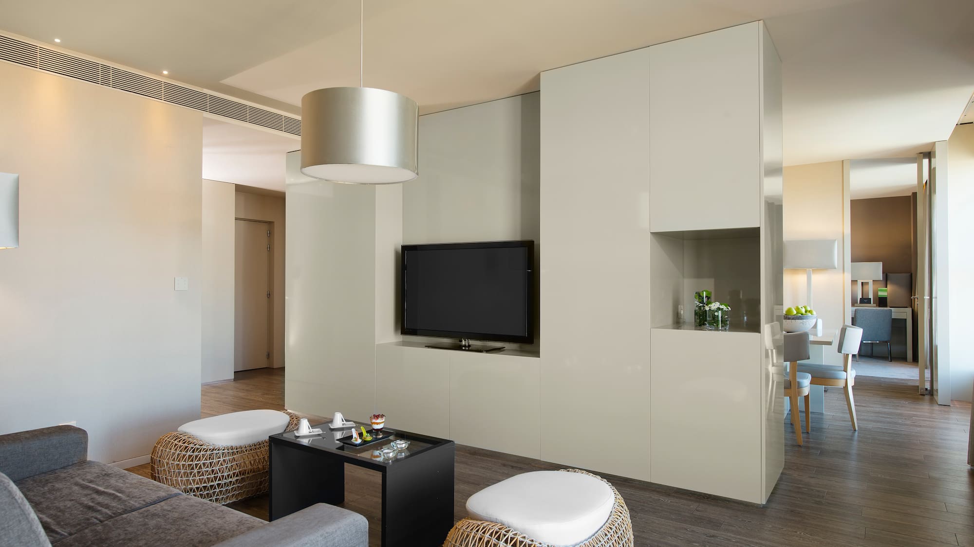 a living room with a television and a table