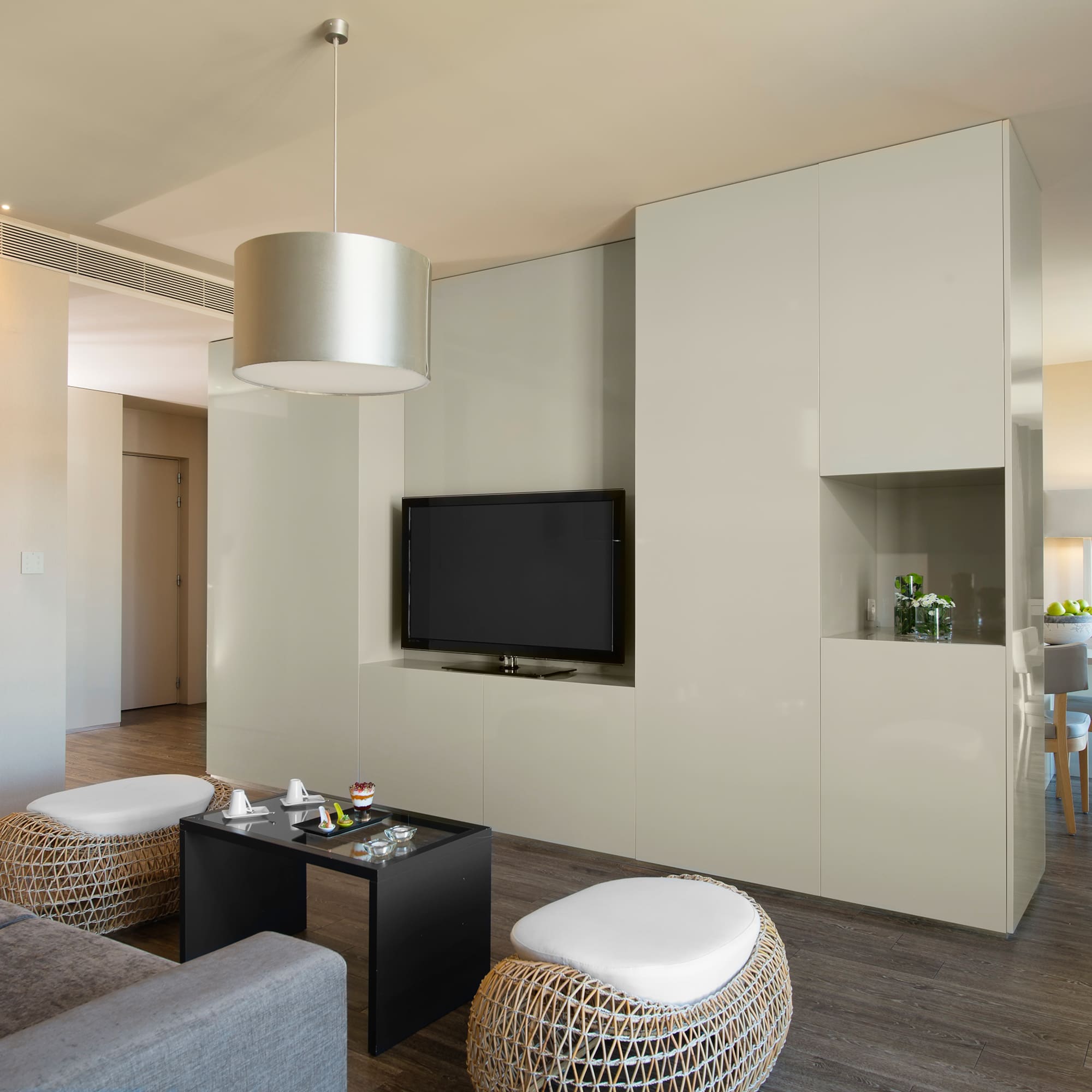 a living room with a television and a table