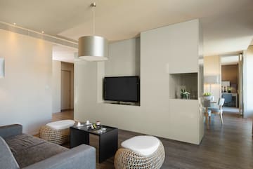 a living room with a television and a table