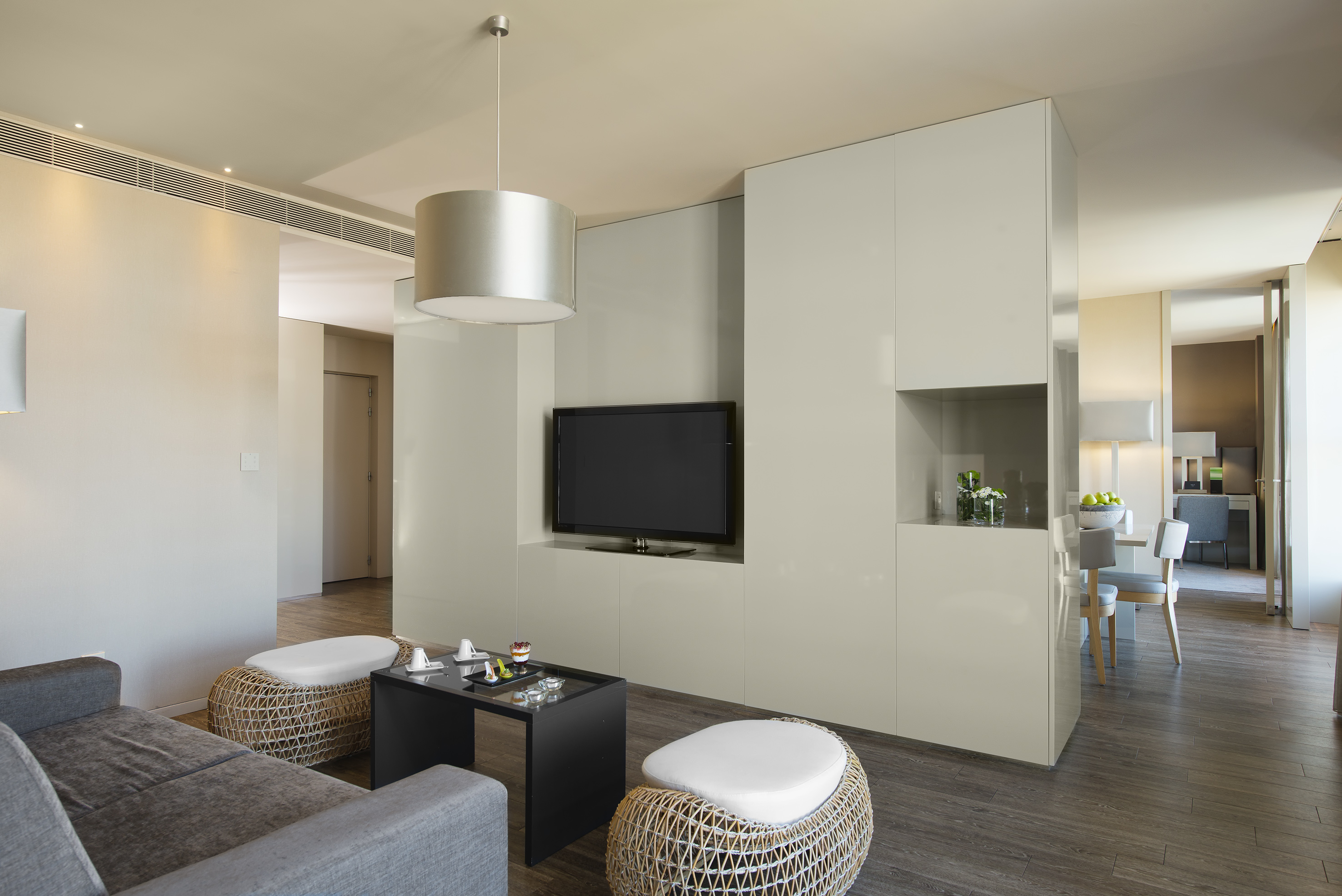 a living room with a television and a table