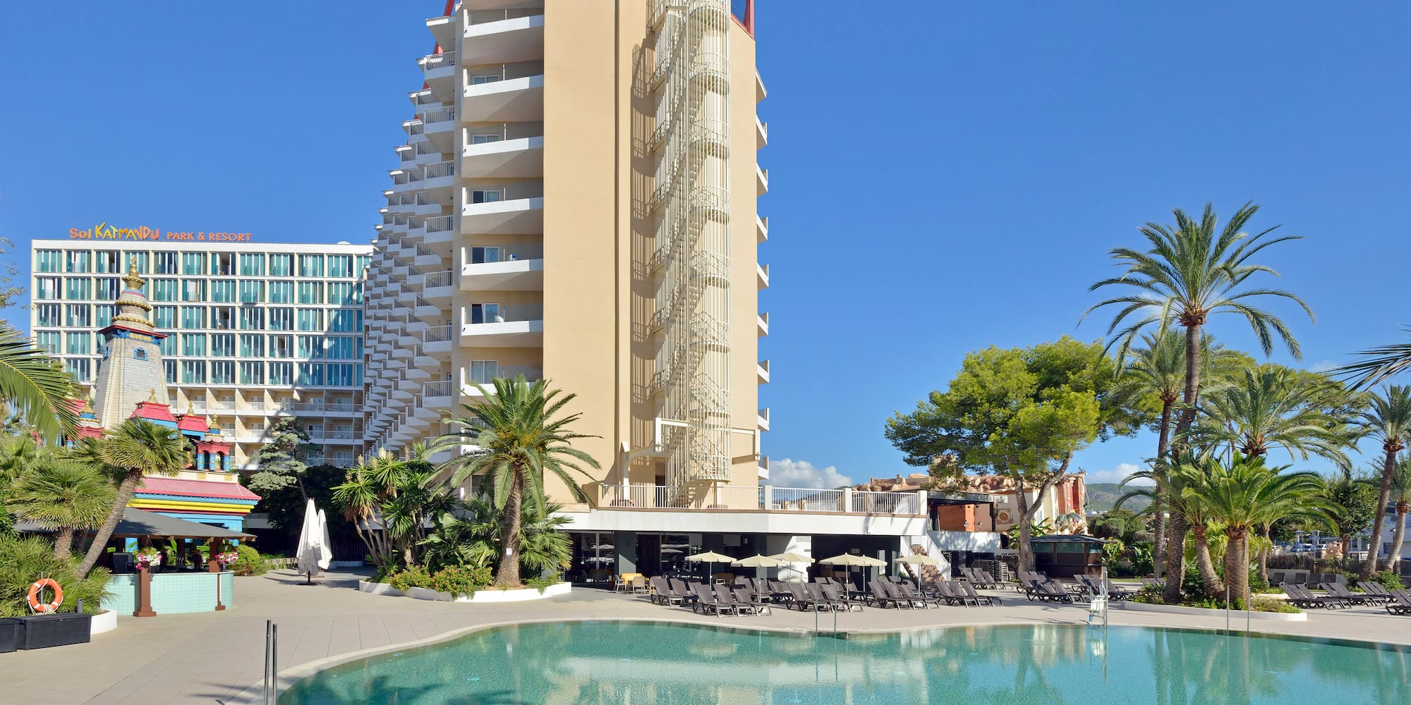 a pool with a building in the background
