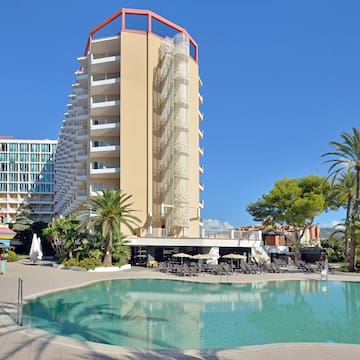 a pool with a building in the background