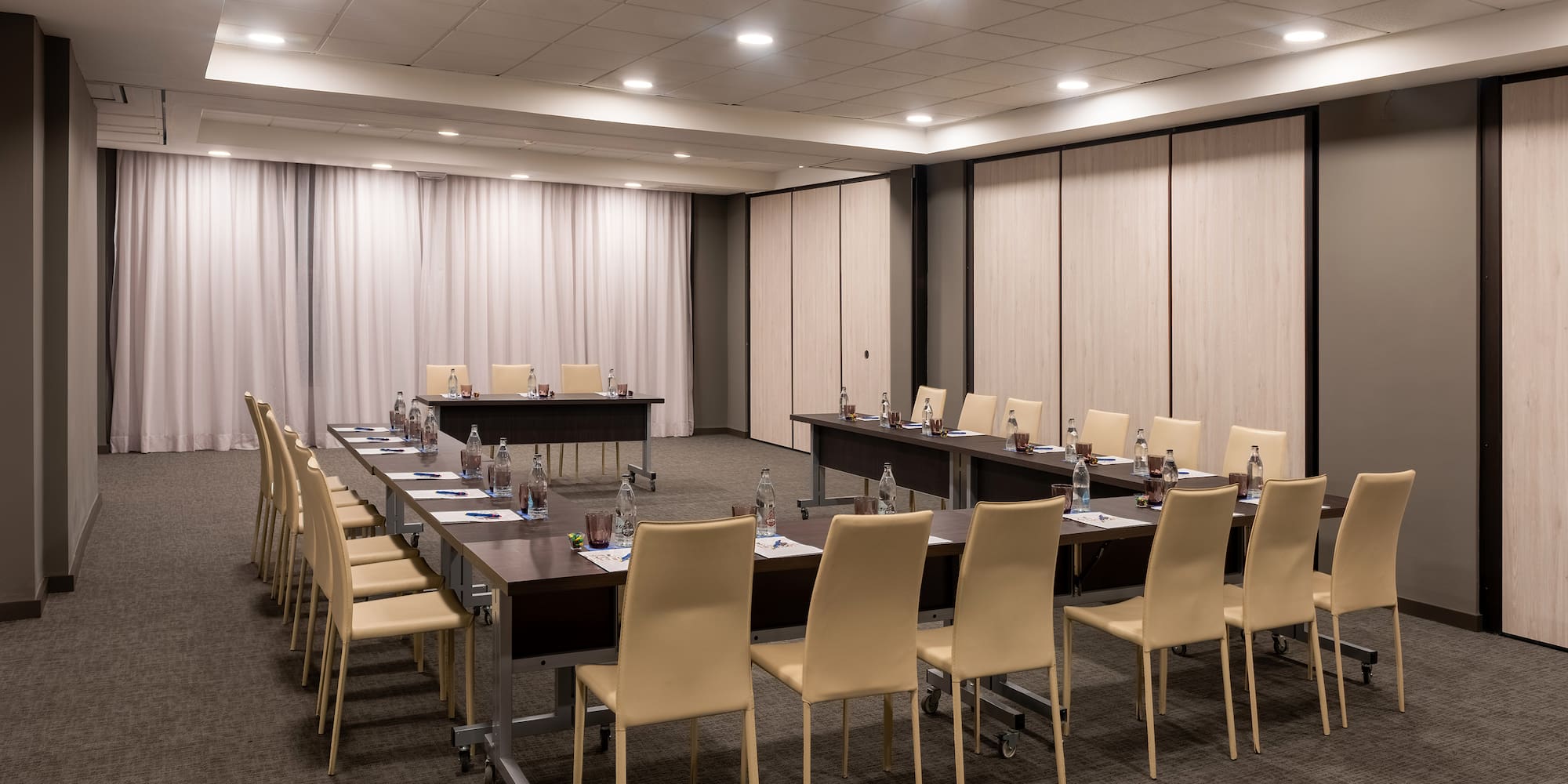 a room with tables and chairs