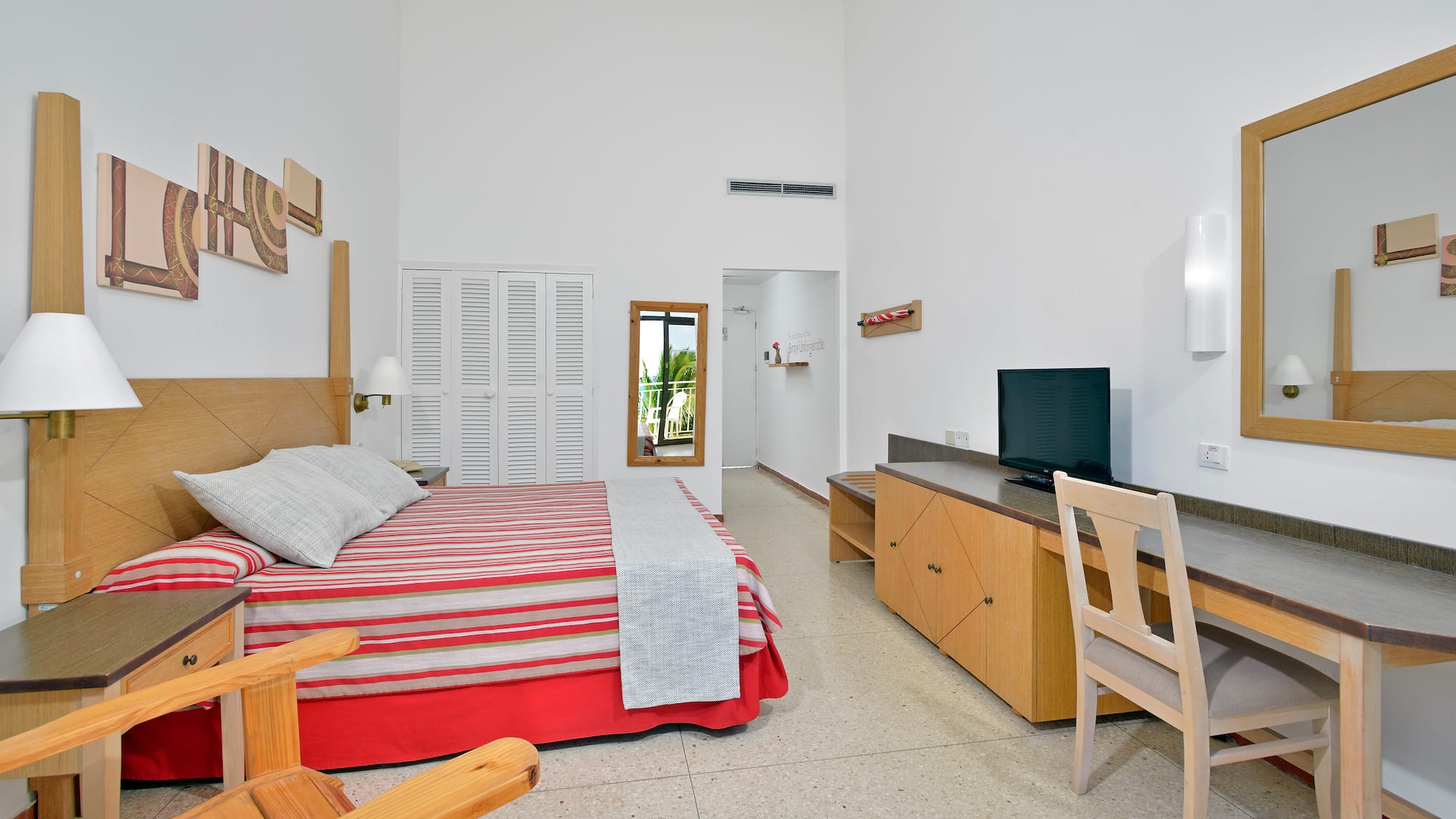 a bedroom with a bed and a desk