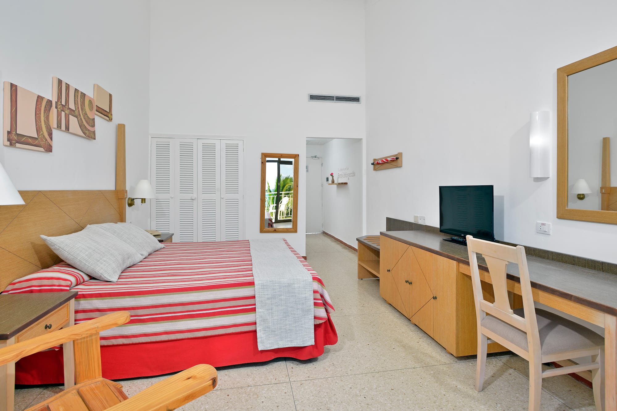 a bedroom with a bed and a desk