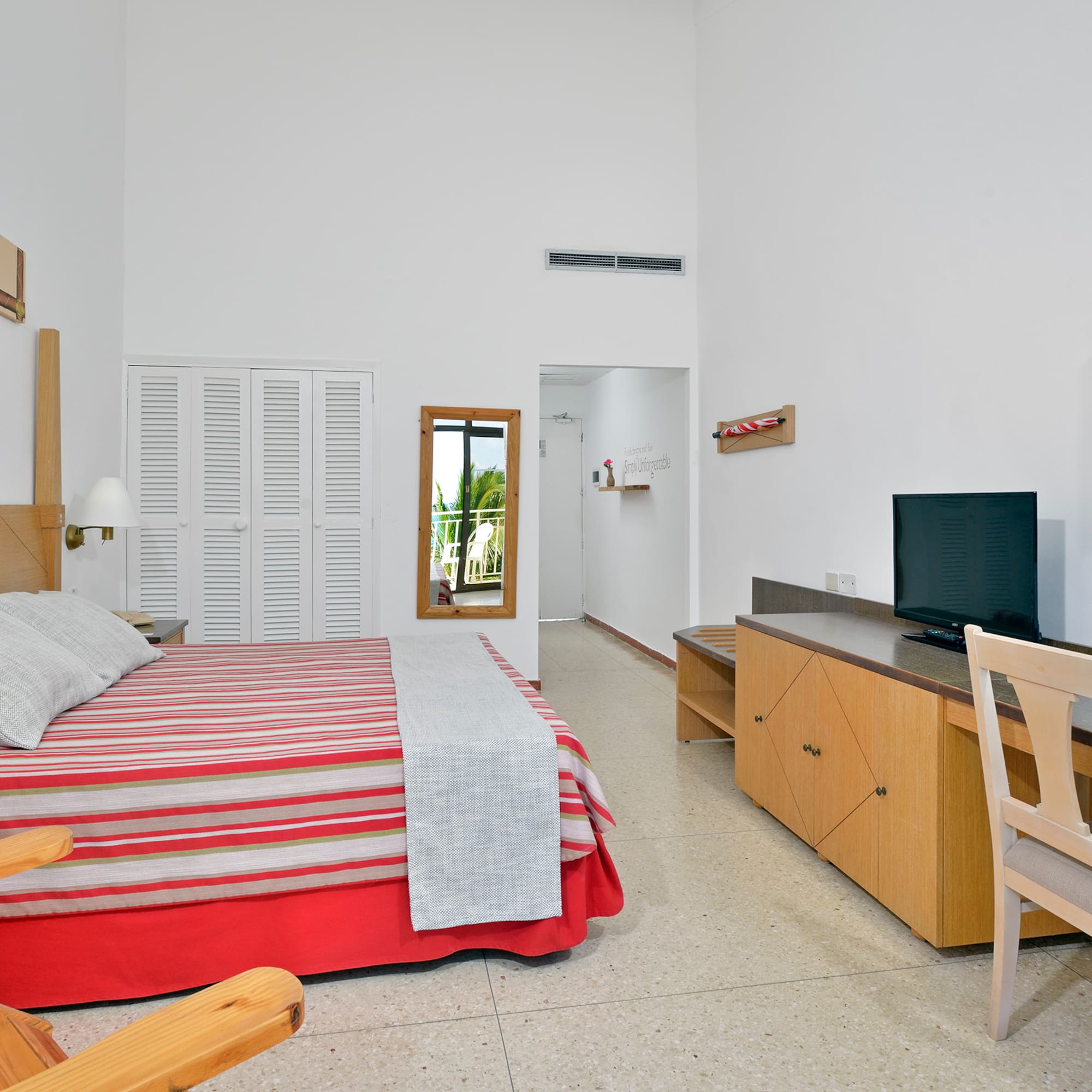 a bedroom with a bed and a desk