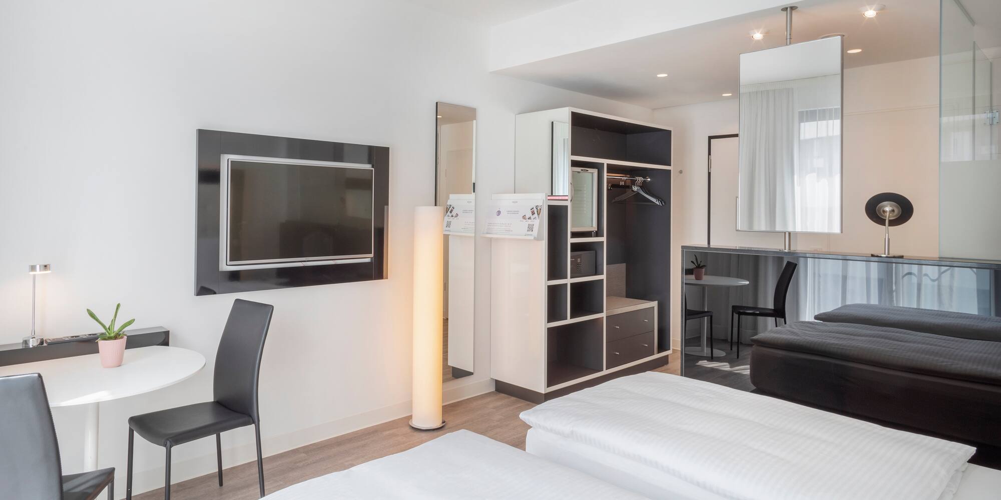 a room with a tv and a bed