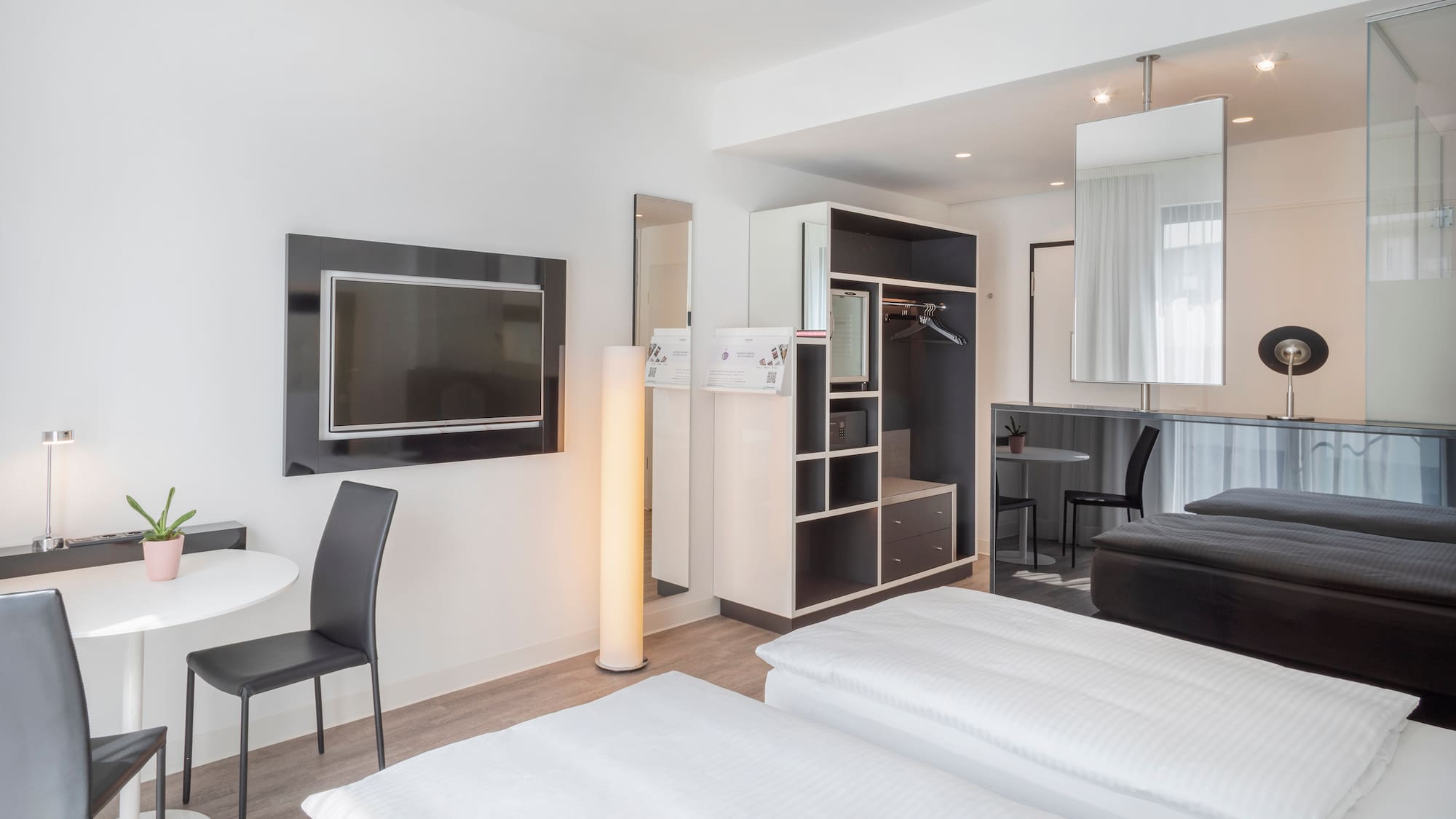 a room with a tv and a bed