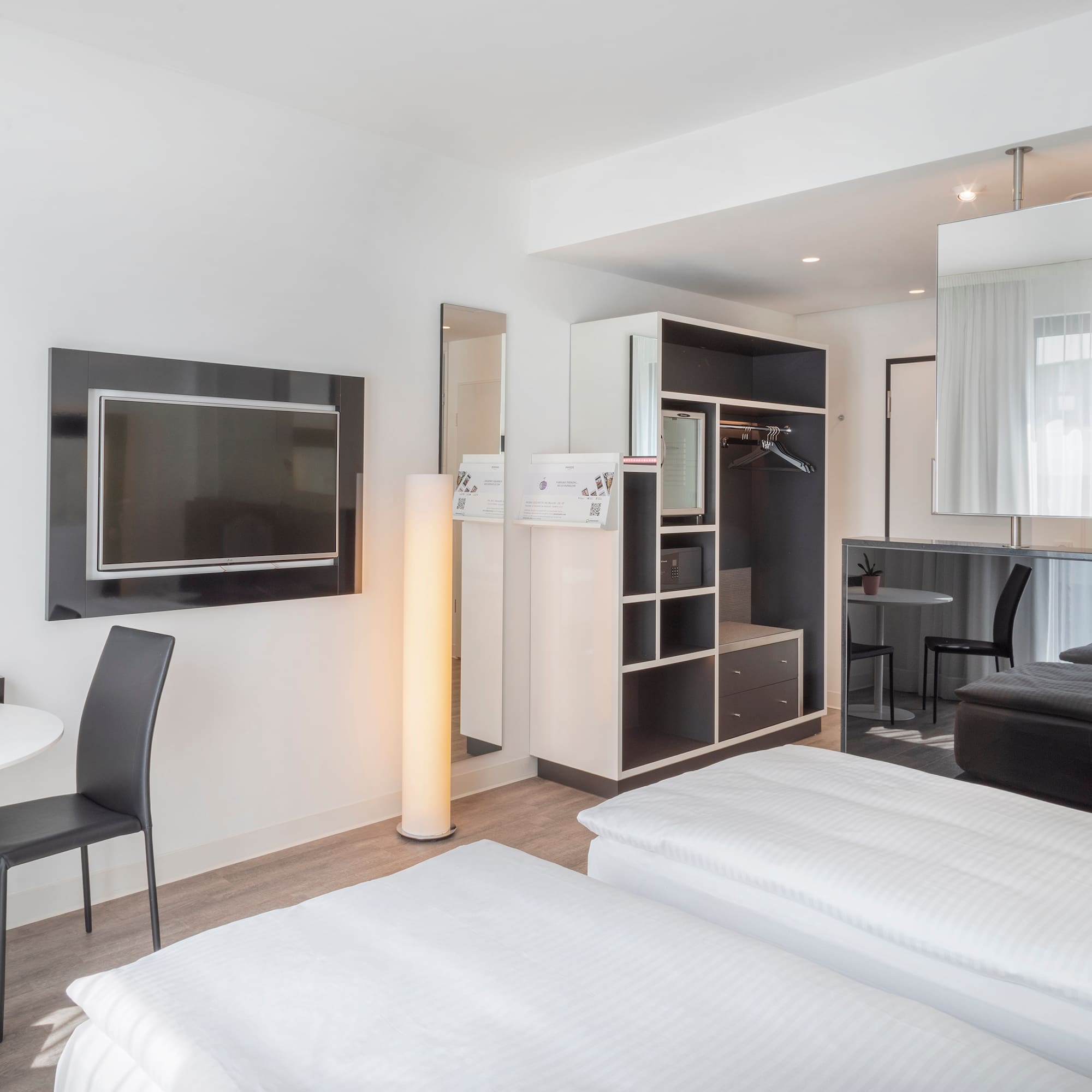 a room with a tv and a bed