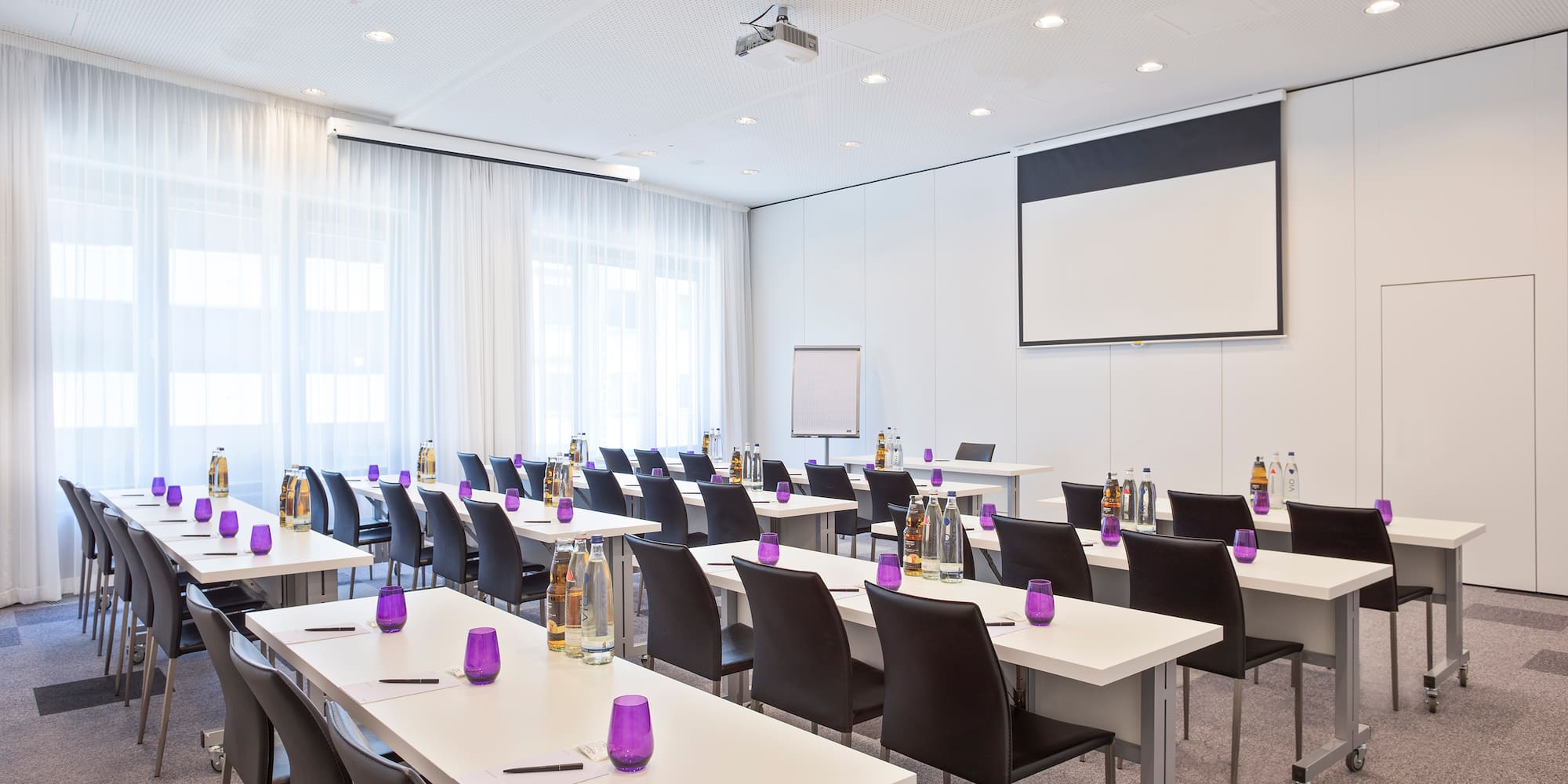 a room with tables and chairs