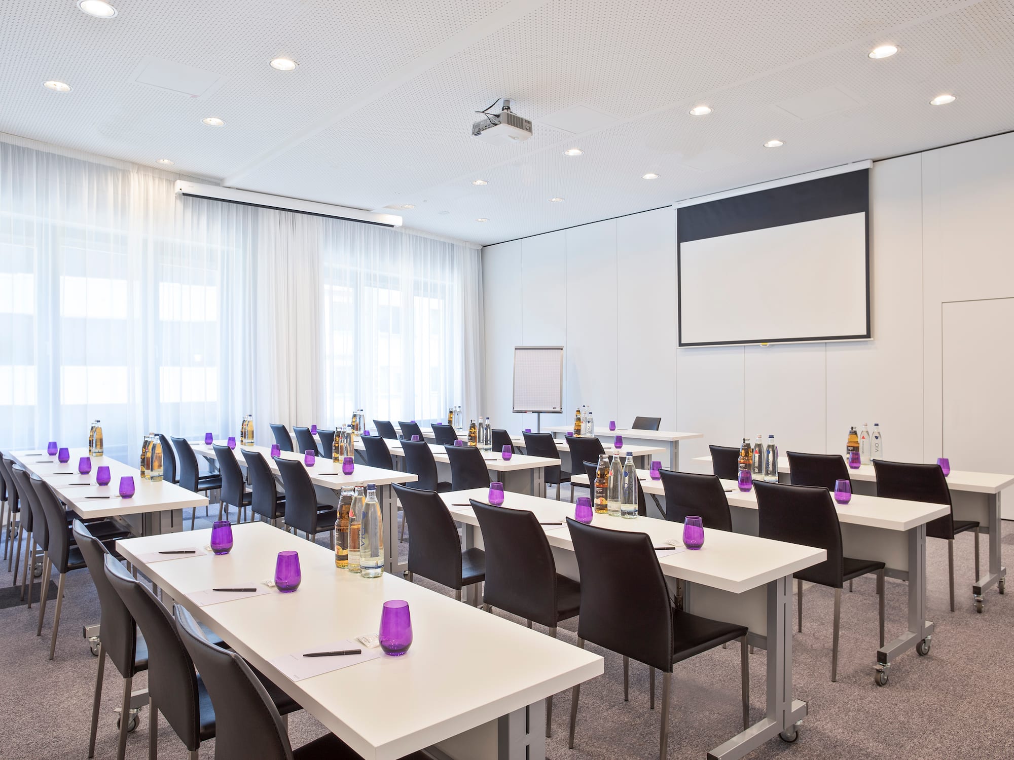 a room with tables and chairs