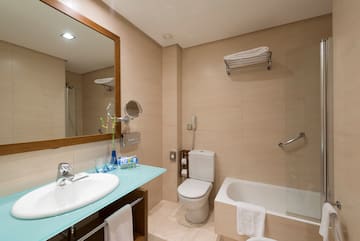 a bathroom with a sink toilet and bathtub